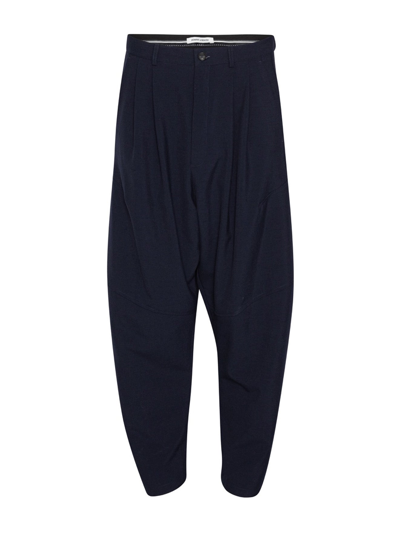 Henrik Vibskov Ants Pants in Dark Navy with a dropped-crotch silhouette, pleated front and tapered legs.
