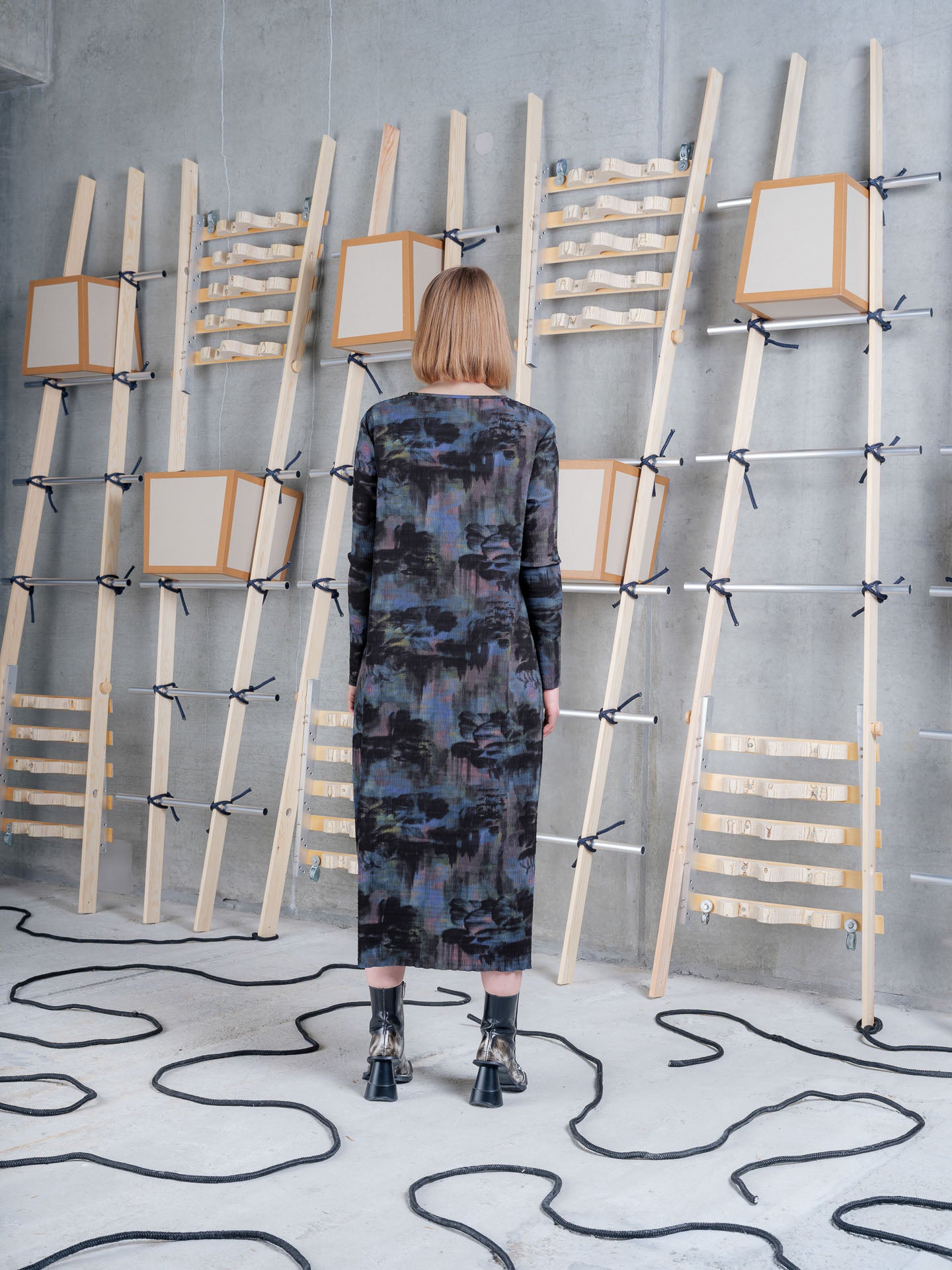 Model wearing Henrik Vibskov Carry O Dress in Mushroom Tapestry back view