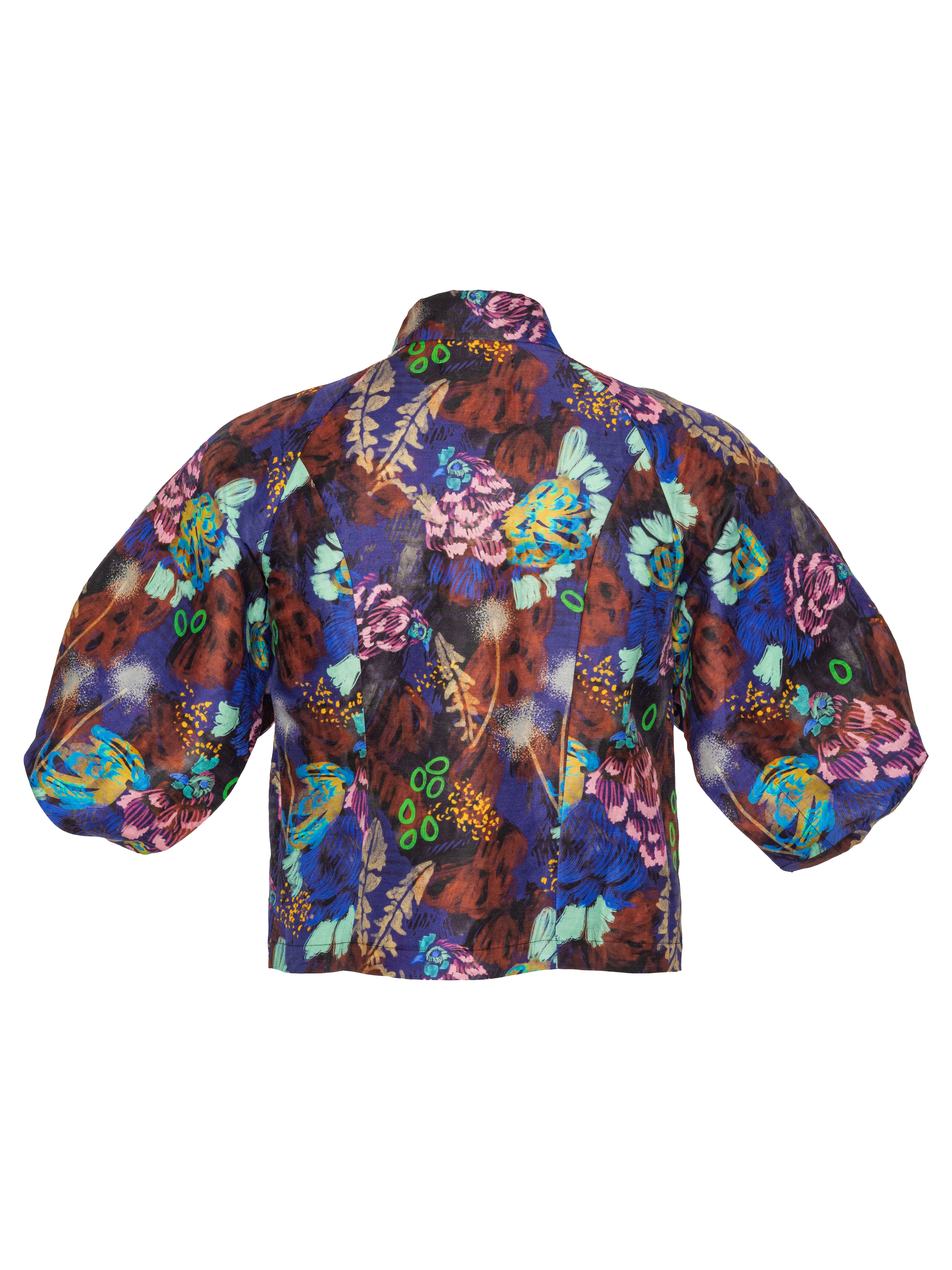 Back full-body packshot of the Case Shirt in Space Chickens from Henrik Vibskov Spring/Summer 2026 Studio Collection, showing the colourful all-over print, 3/4-length raglan sleeves, and straight back hem.