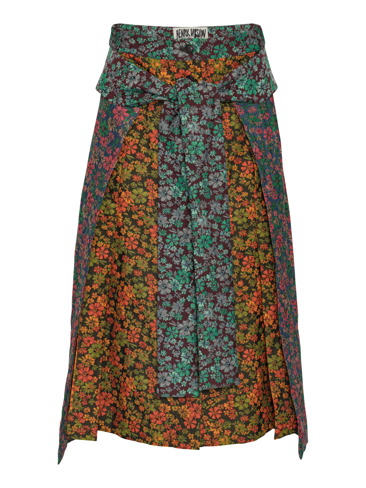 Henrik Vibskov Leek Skirt in Floral Affairs, front view showing a floral patchwork print, wrap-style panel, self-tie waist and A-line midi silhouette.