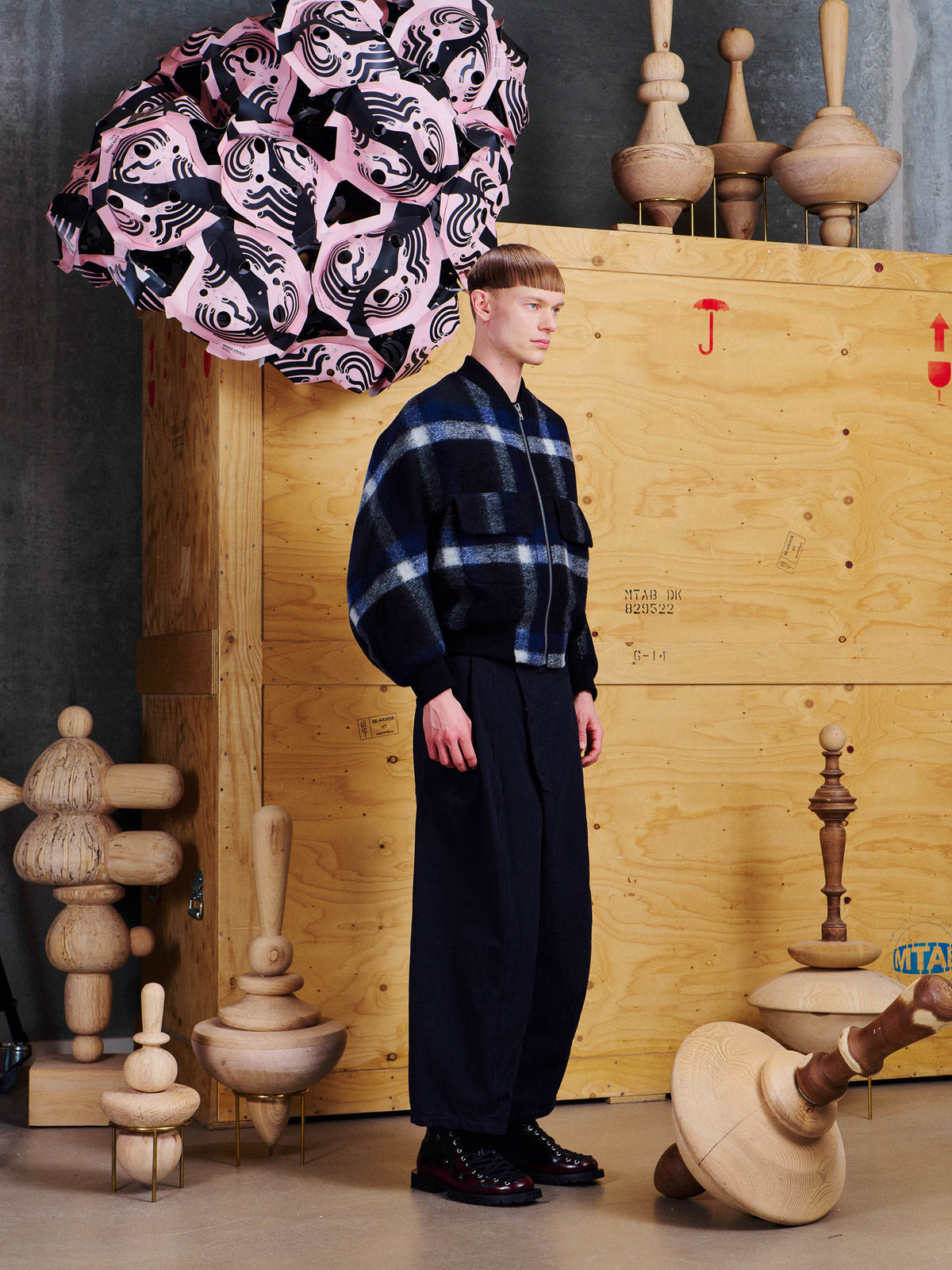 Side view of male model wearing Henrik Vibskov Merry Bomber, showing the rounded sleeve volume and cropped ribbed hem.