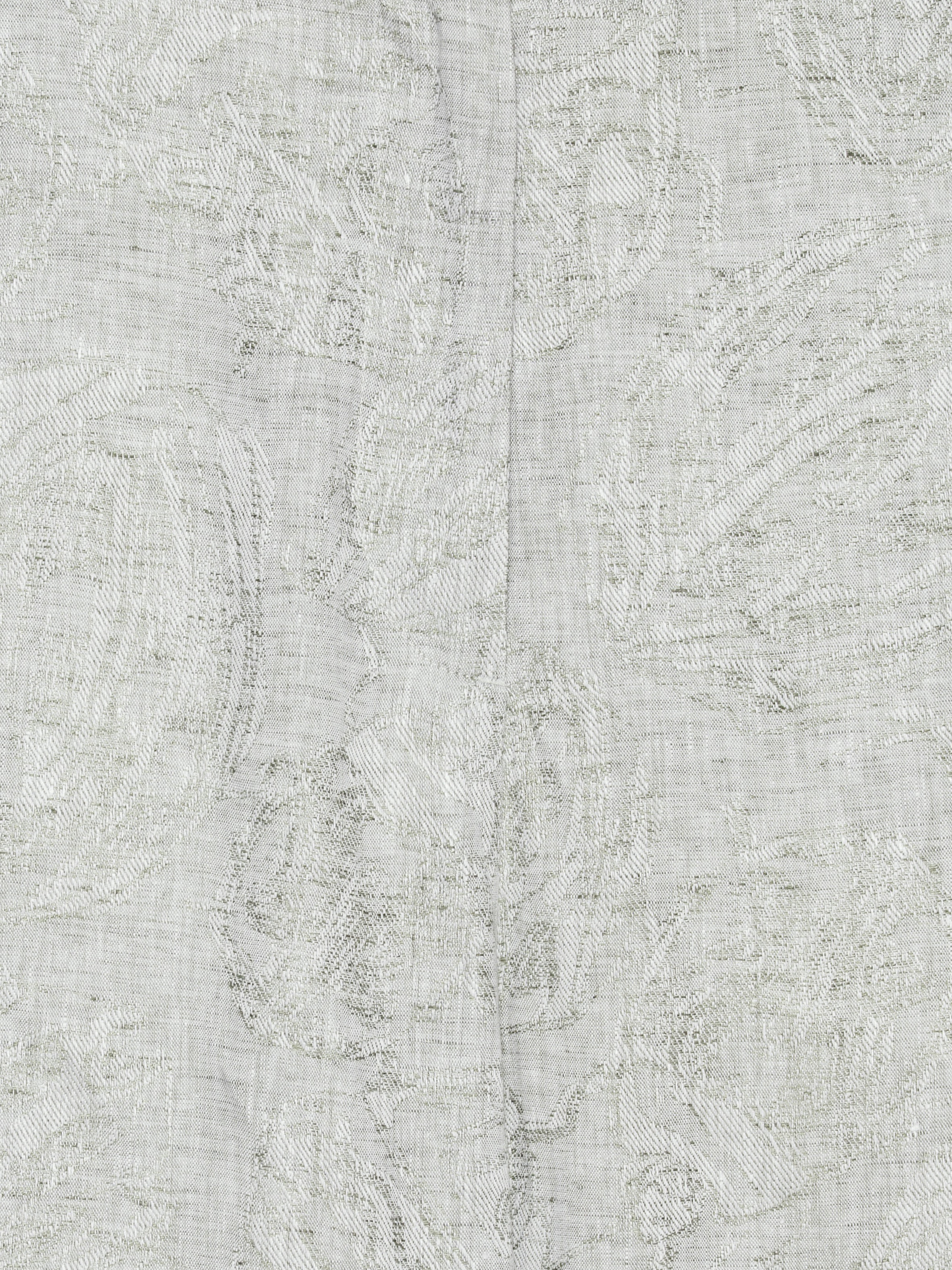 Close-up of the grey textured floral material, showing belt loops and detailed fabric texture.