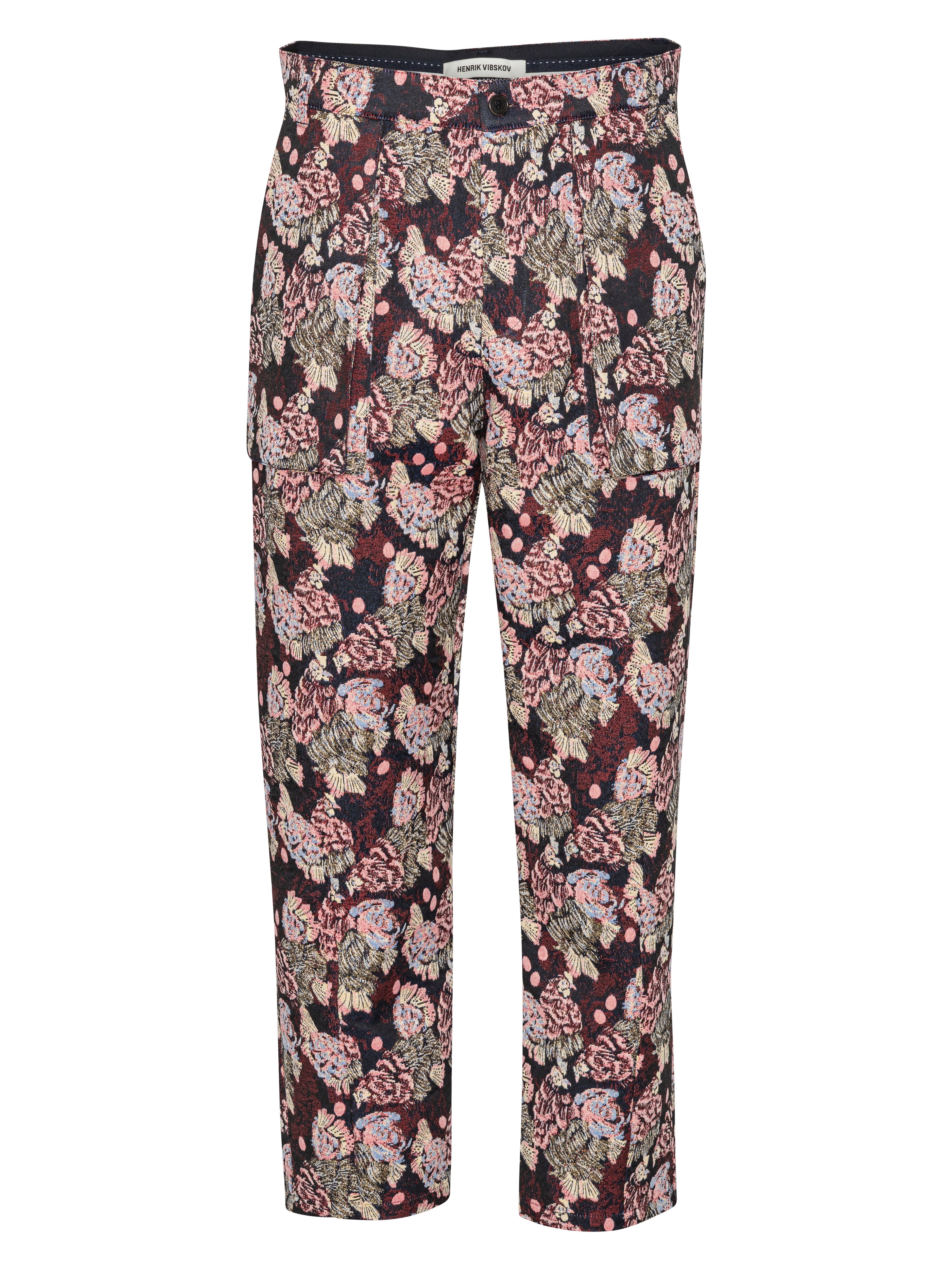 Floral and chicken patterned pants by Henrik Vibskov on a white background
