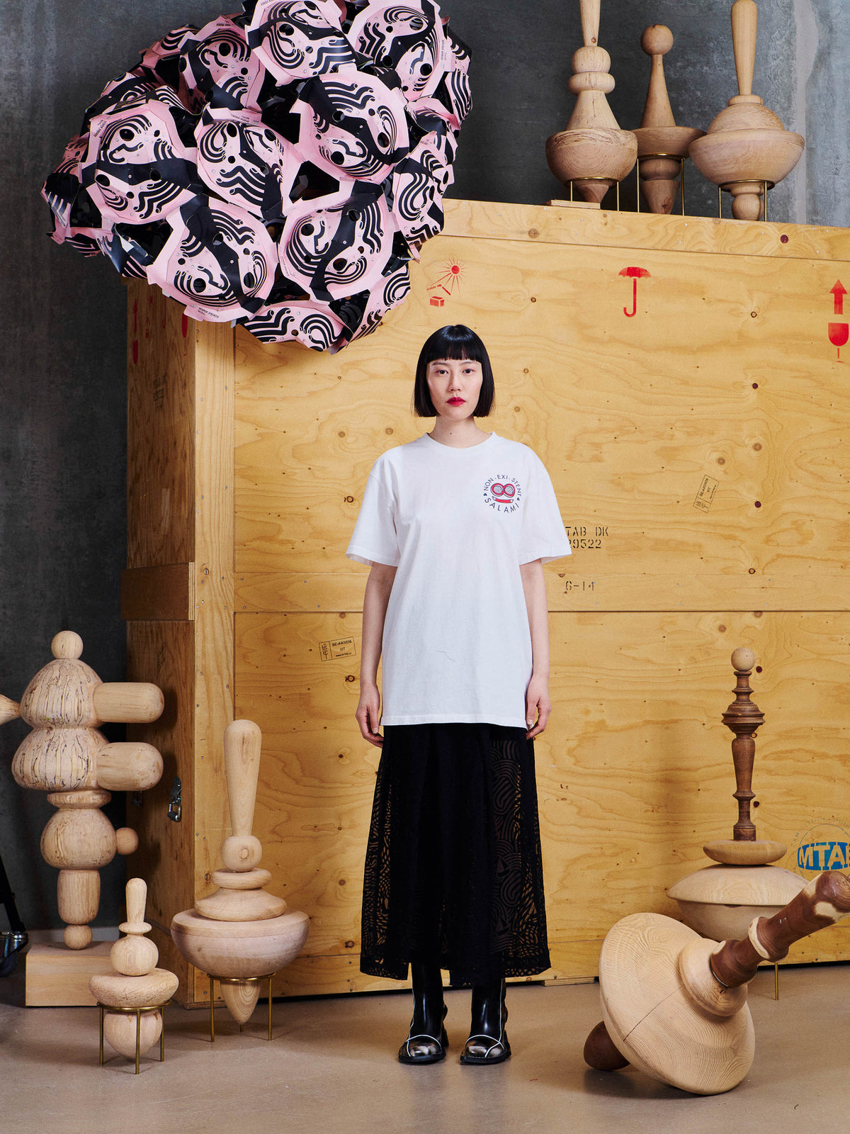 Henrik Vibskov Salami Tee in Cloud worn by female model with black skirt