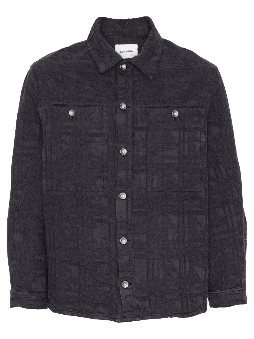 Henrik Vibskov Toadally Denim Jacket in Black, front view, tonal jacquard texture, point collar, silver press-stud fastening, twin chest flap pockets, relaxed fit
