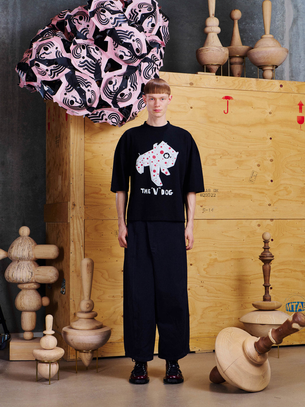 Model wearing the Henrik Vibskov V Dog Tee in Black from the front, showing the oversized fit, dropped shoulders and graphic dog print.