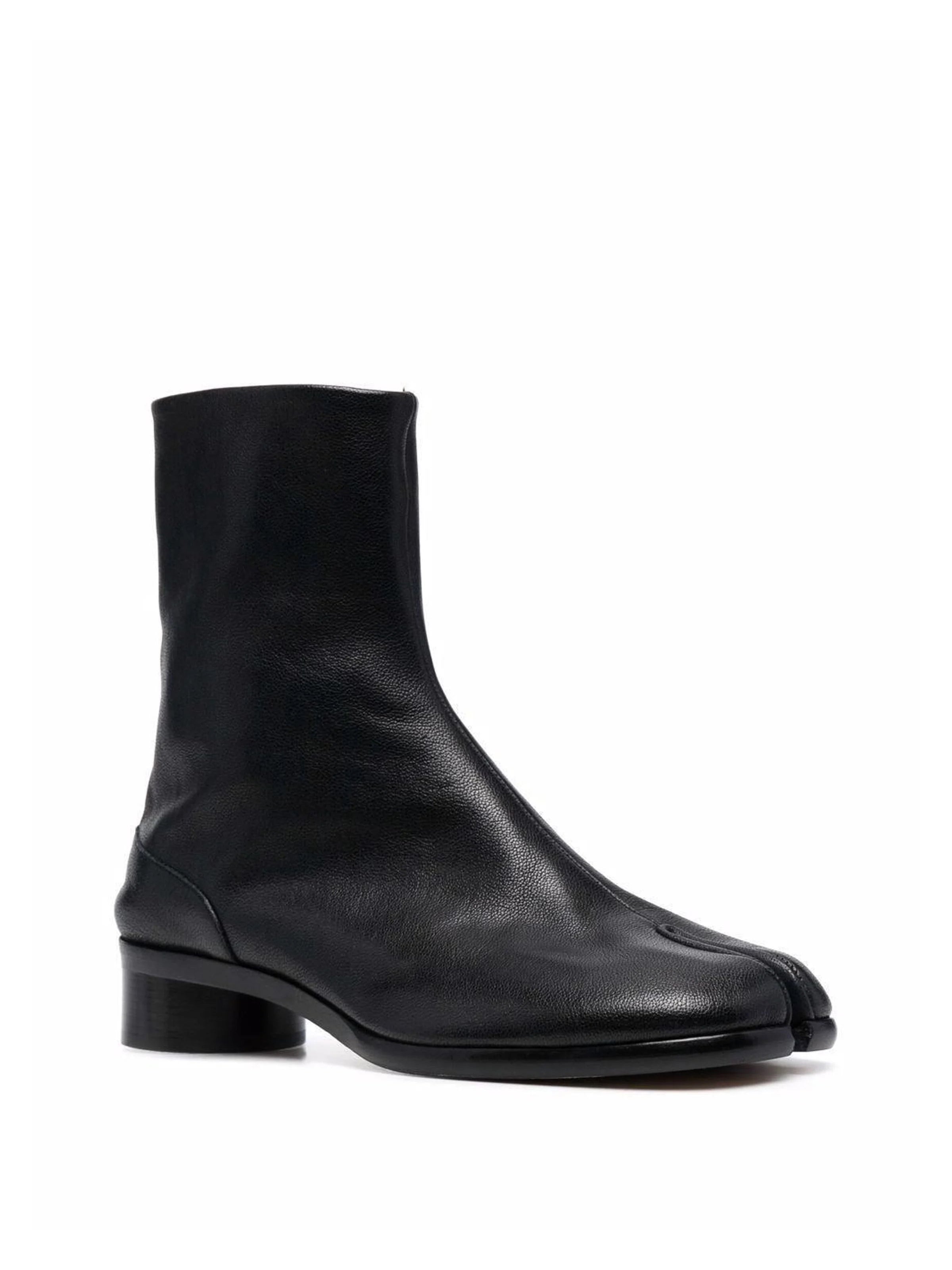 Maison Margiela Tabi Ankle Boot H30 in Black, three-quarter front view, signature split toe silhouette, smooth black leather upper, block heel, back zip fastening