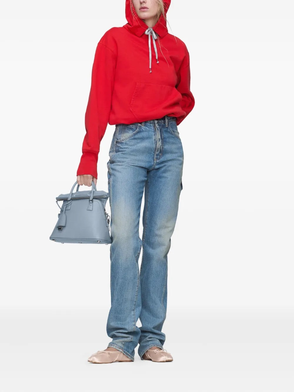 Front view of a female model wearing the Maison Margiela Pants 5 Pockets in Light Blue Indigo, highlighting the tailored silhouette, five-pocket details, and straight leg drape.
