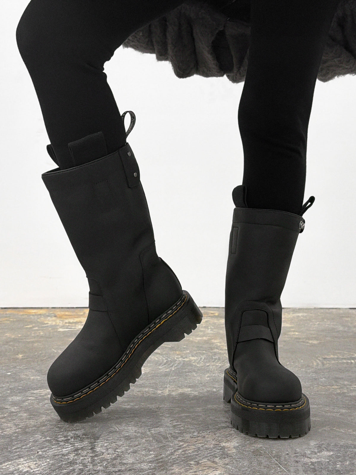 Rick Owens x Dr. Martens Quad Sole Pull On Boots worn on foot, showing the mid-calf height and chunky platform construction.