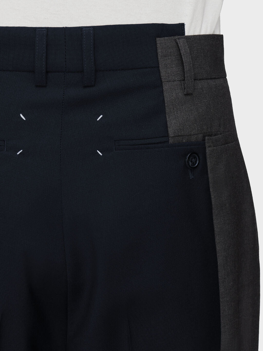 Close-up of waistband and signature four stitches on Maison Margiela Spliced Tailored Trousers