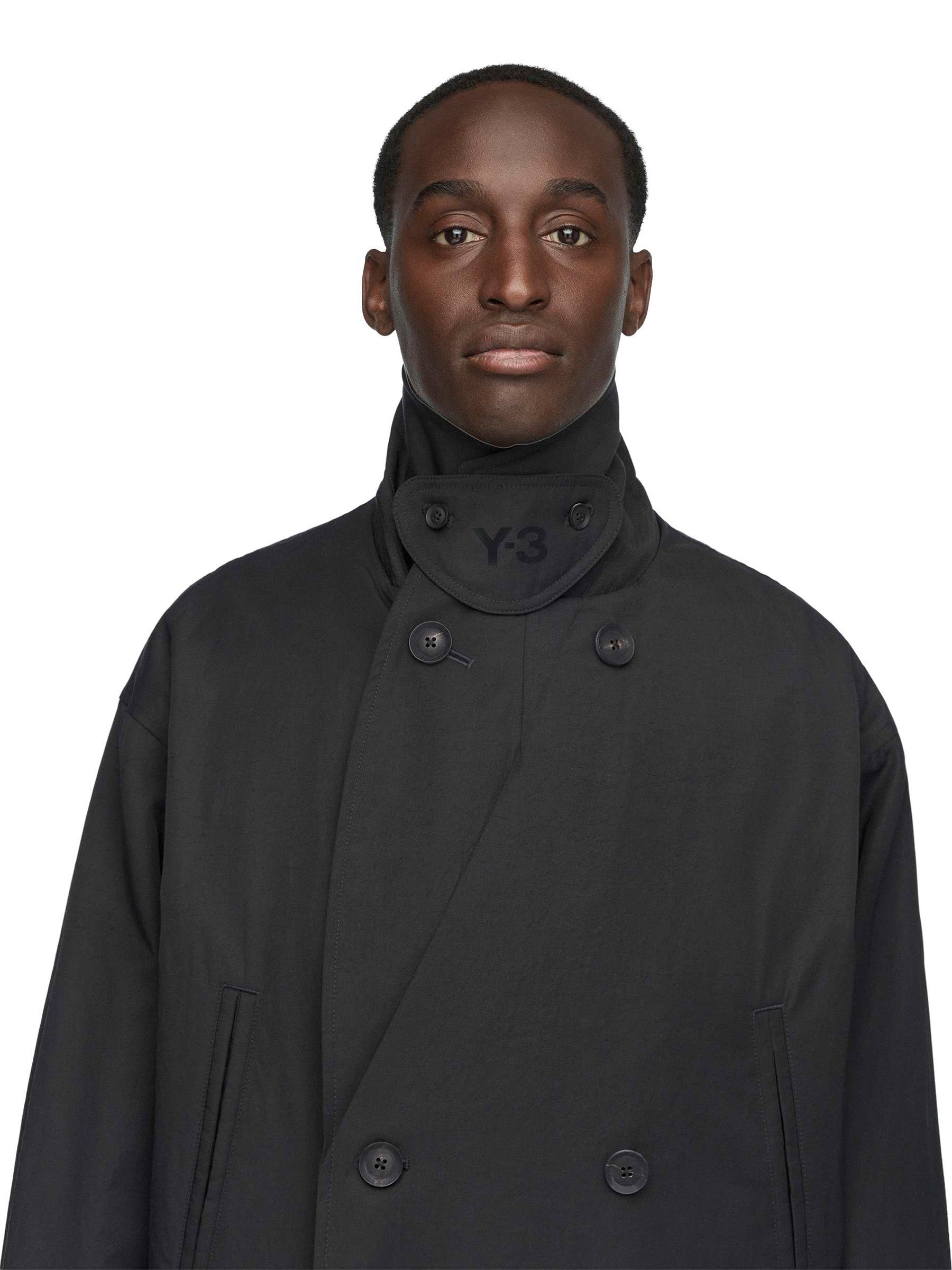 Close-up view of the collar and double-breasted fastening on the Y-3 Spun Nylon Cabban Coat in Black.