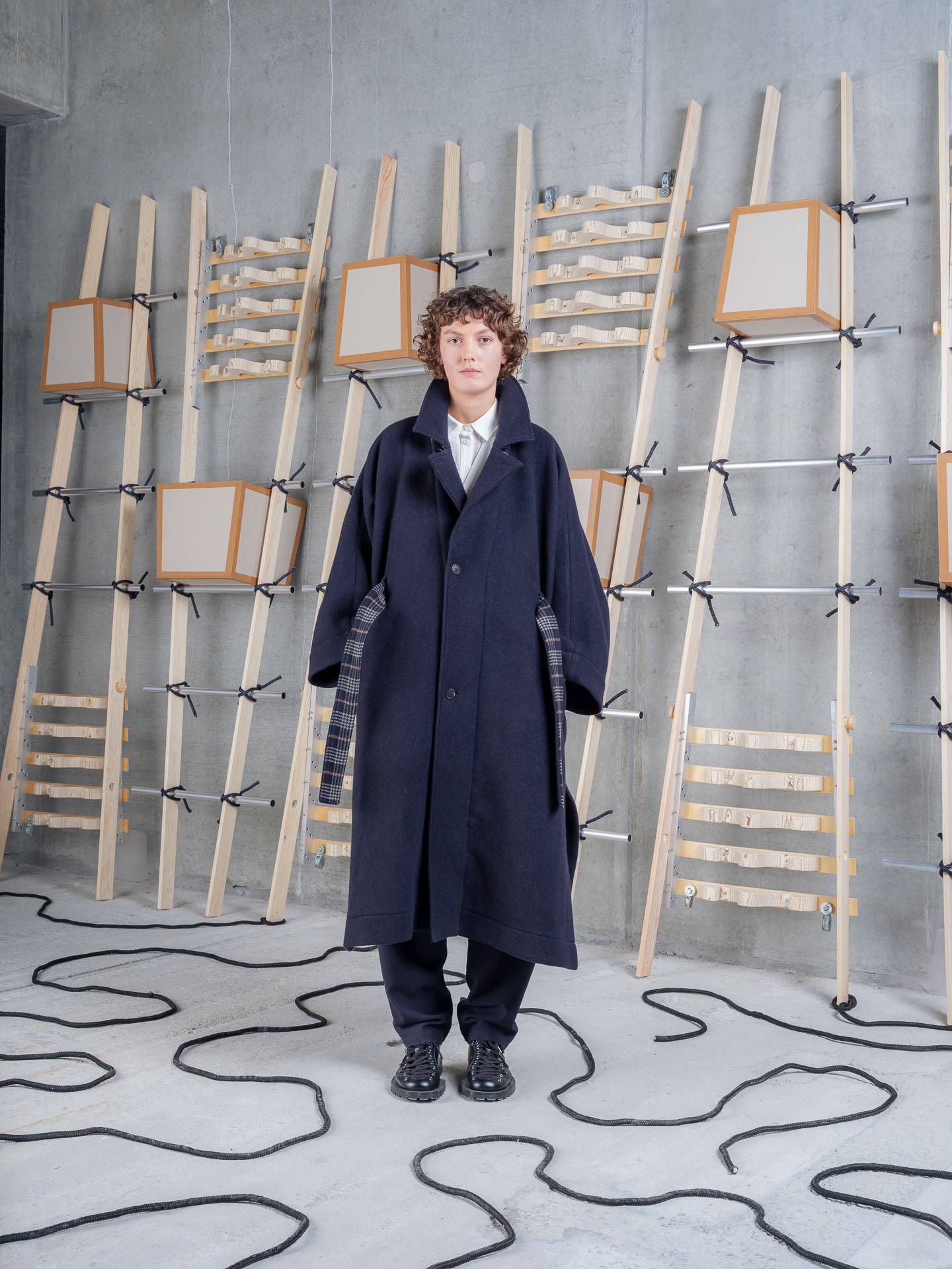Model wearing Henrik Vibskov Toadcoat in Navy Duffle front view