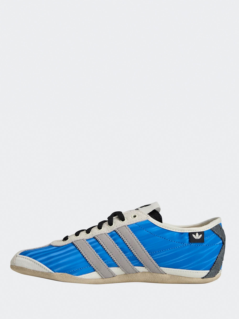 Adidas Tokyo W SFTM in Blue/Solid Grey/Off White - three-quarter front view showing blue upper with grey three stripes and lace-up closure