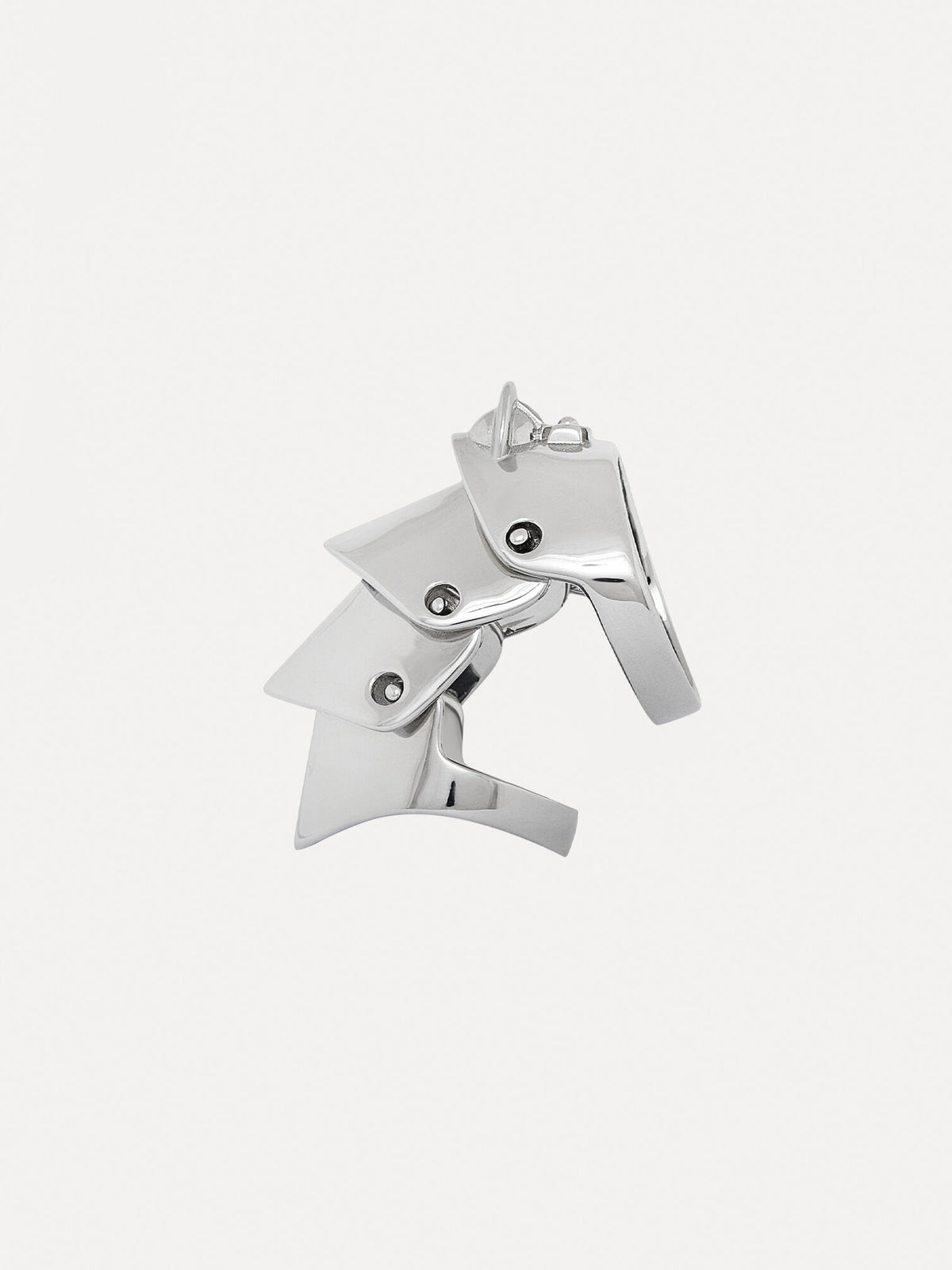 Silver ring with four platinum-plated silver sections that overlap on a white background