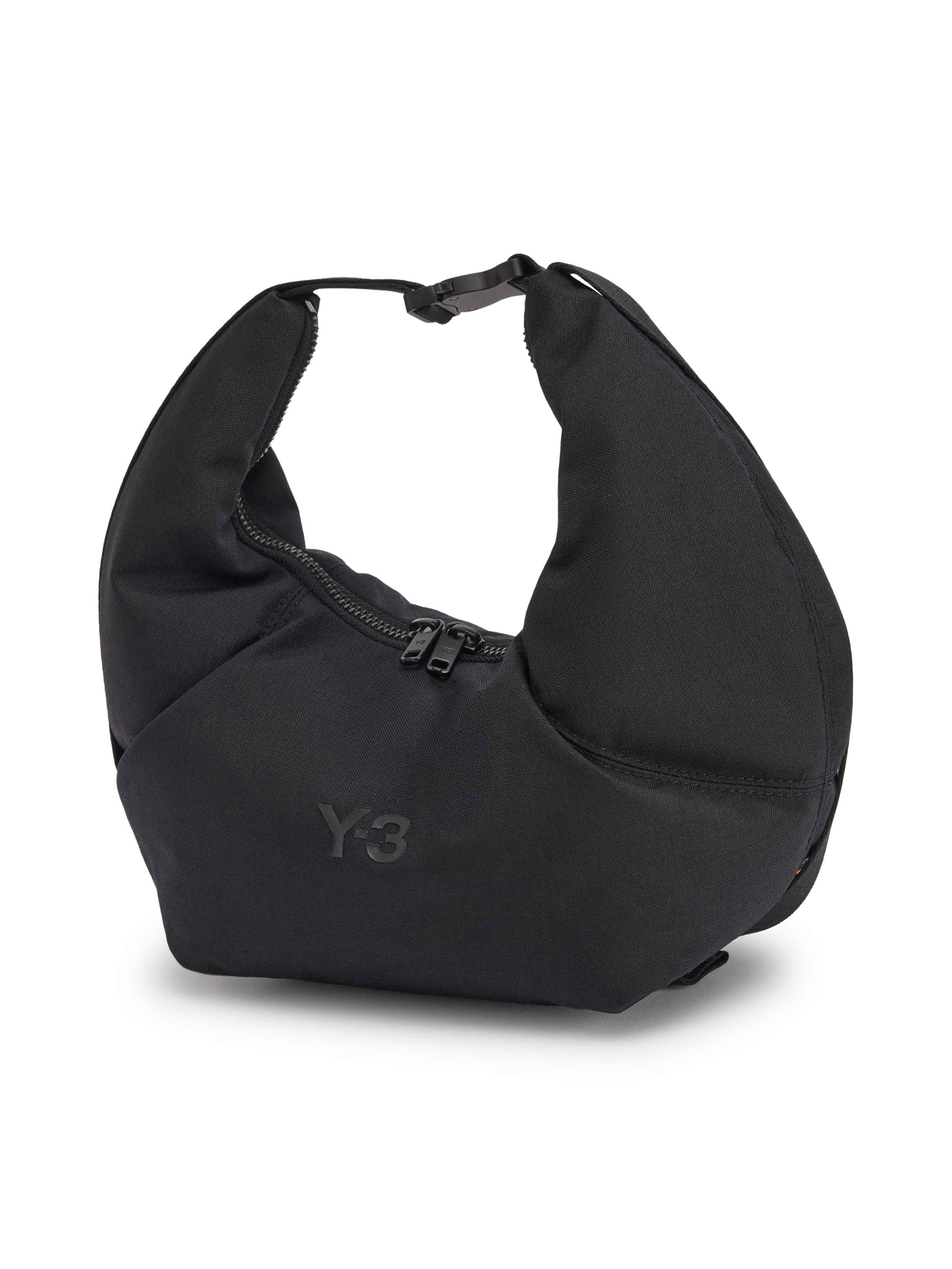 Y-3 Crescent Bag in Black, front three-quarter view, embossed Y-3 logo detail, structured soft crescent body, tonal zip closure