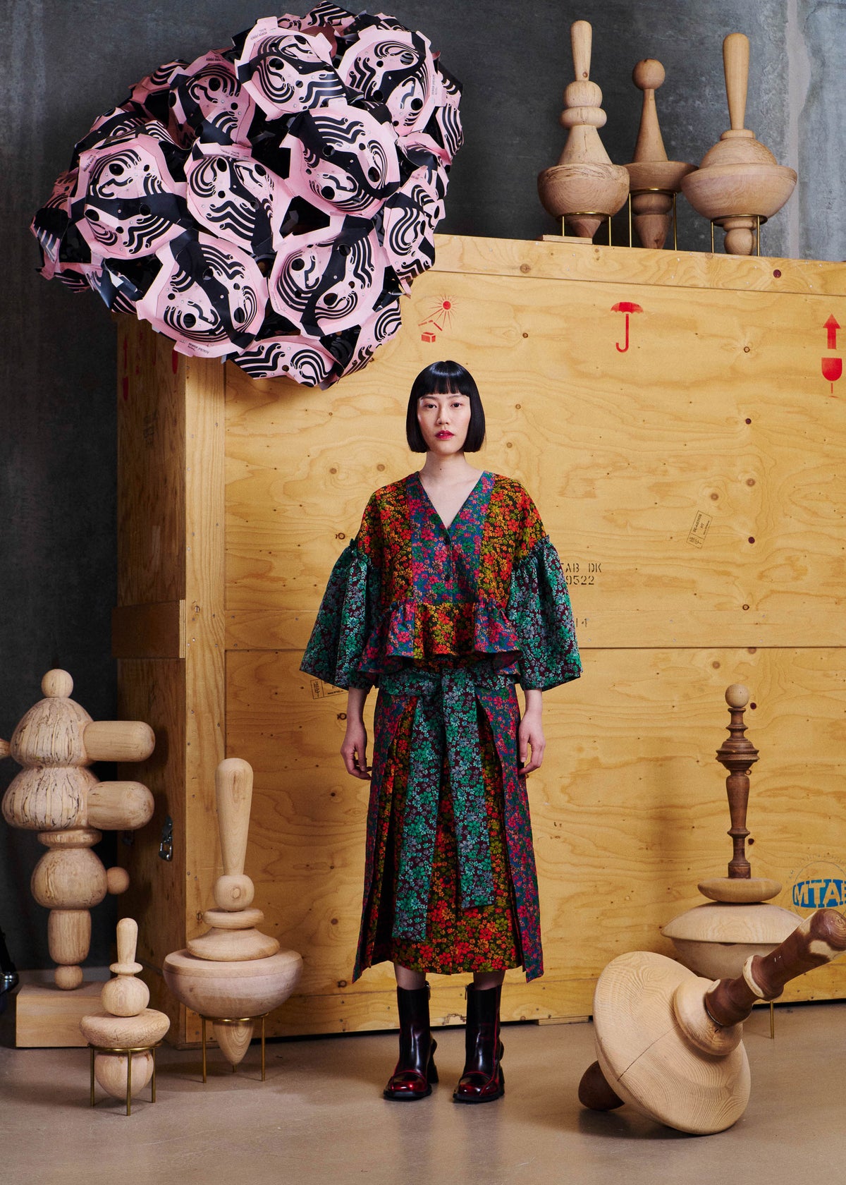 Henrik Vibskov Leek Skirt in Floral Affairs worn front view with matching floral top, showing the layered wrap-style front and self-tie waist detail.