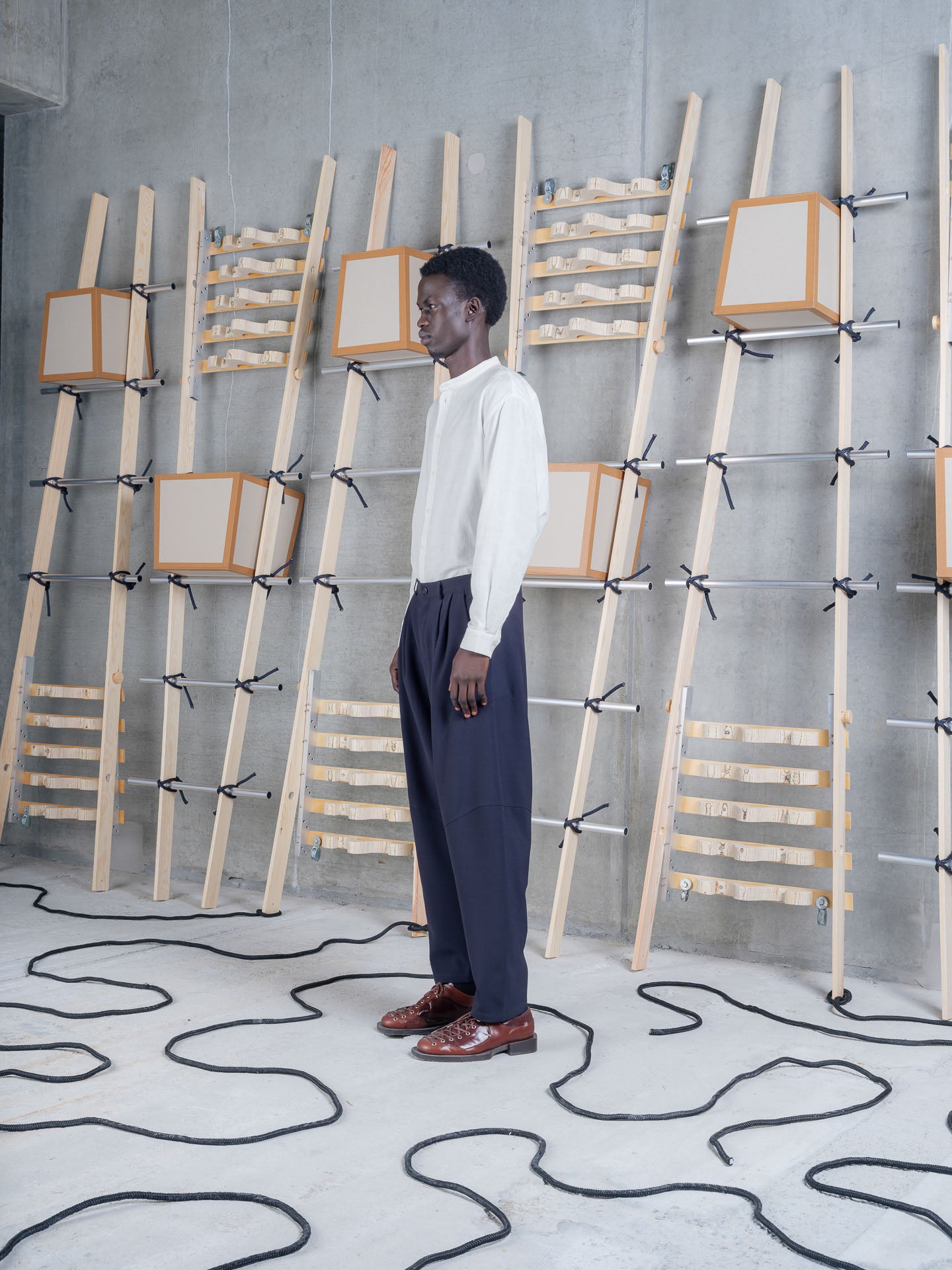 Side view of Henrik Vibskov Ants Pants in Dark Navy showcasing the relaxed silhouette.