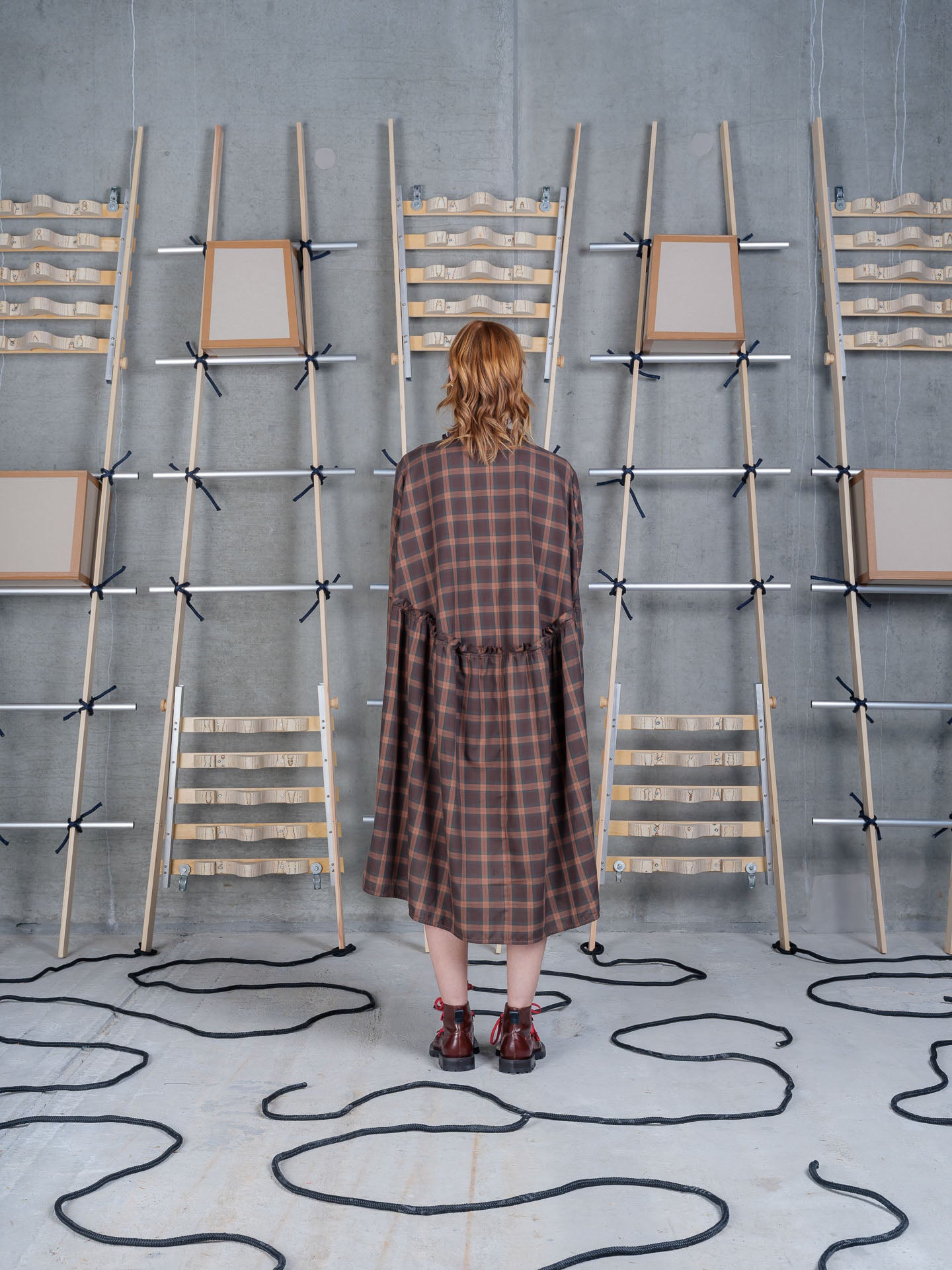 Back view of Henrik Vibskov Bon Chalant Dress LS in Brown Cotton Checks showcasing the checked organic cotton fabric.
