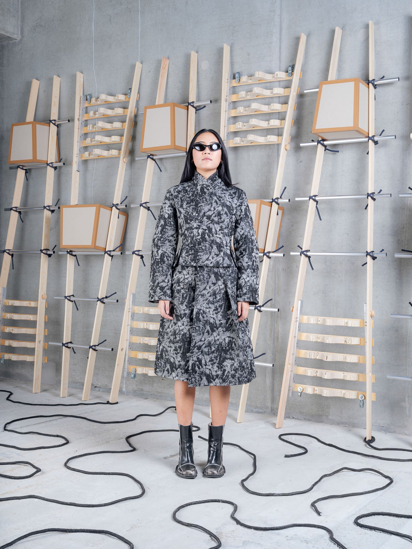 Model wearing Henrik Vibskov Carry Skirt in Black 3D White front view
