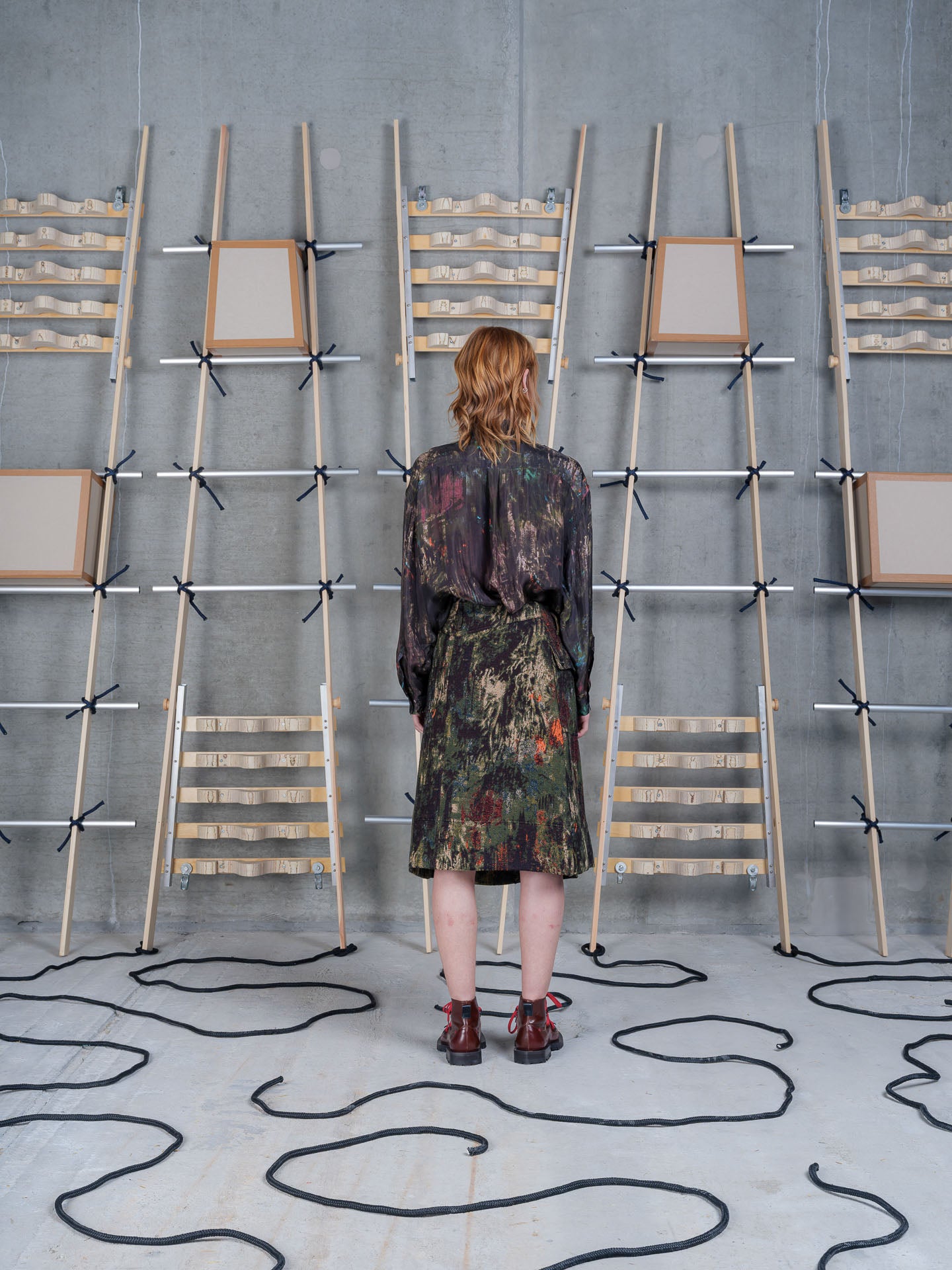 Model wearing Henrik Vibskov Carry Skirt in Gobelin Swamp back view
