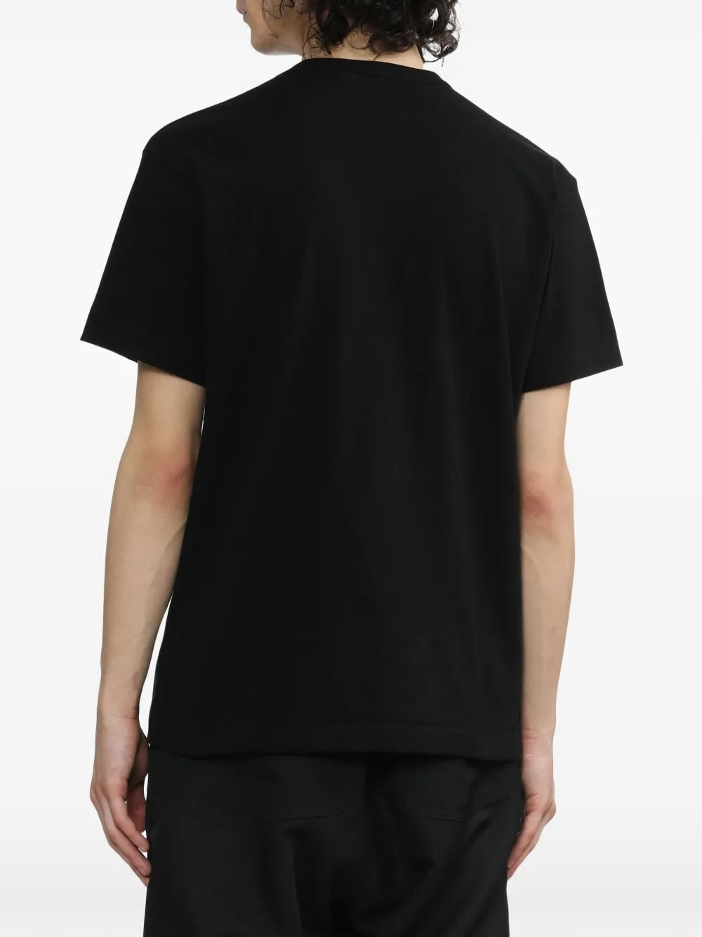 Back view of Comme des Garçons Play black short sleeve T-shirt showing plain jersey back and straight hem