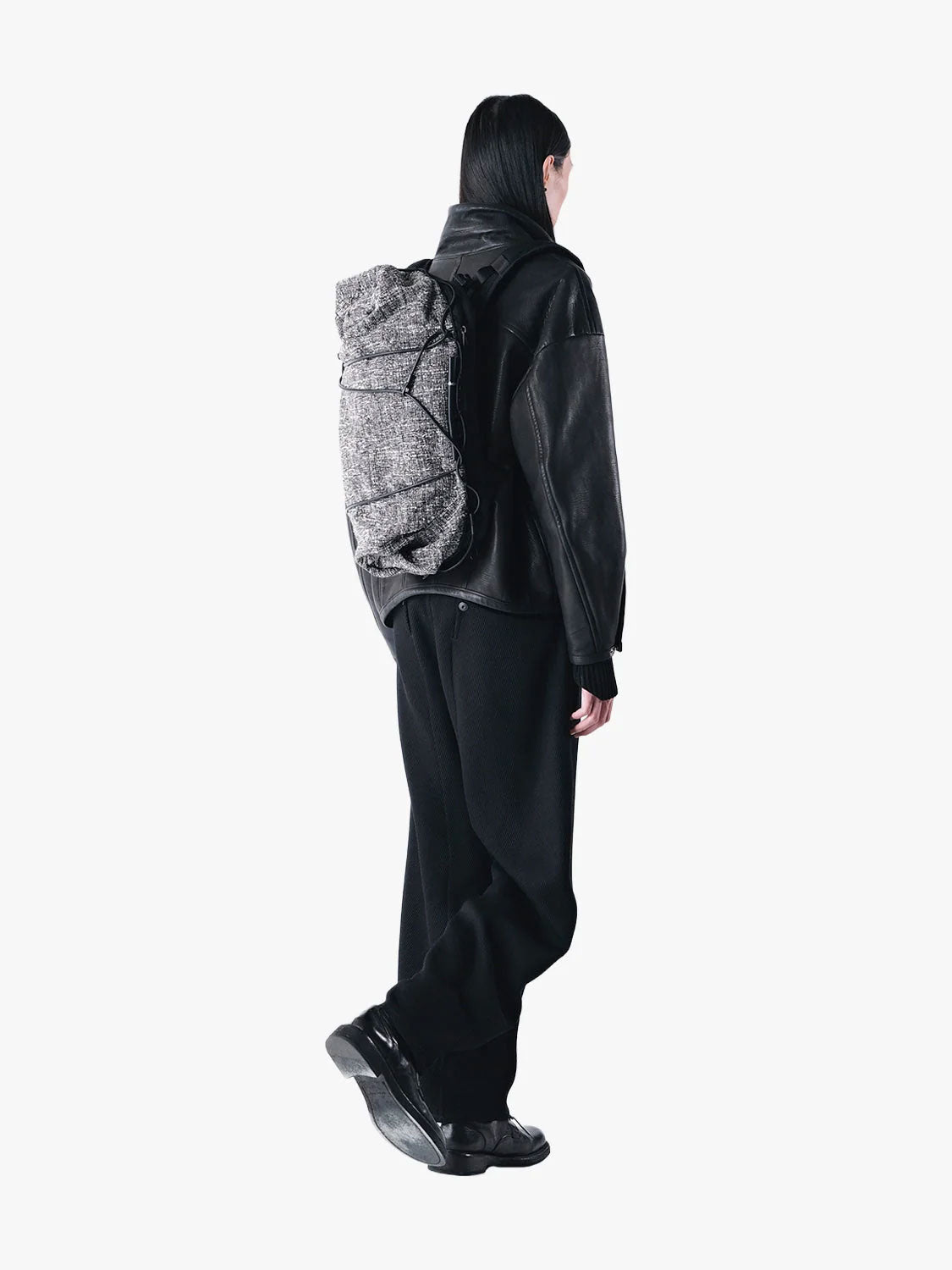 Côte & Ciel Ladon Tweed in Black & Cream backpack worn on the back