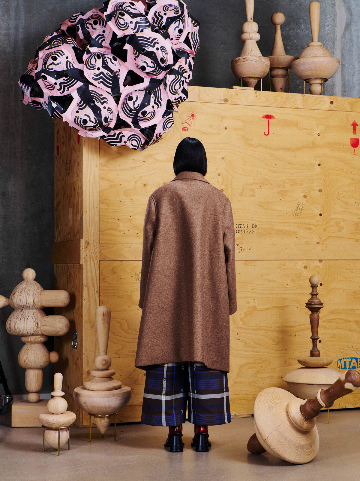 Henrik Vibskov 3D Coat in Camel styled on model from the back, showing clean longline silhouette, straight sleeves and softly structured shape. ID: ARCHIVE-F601