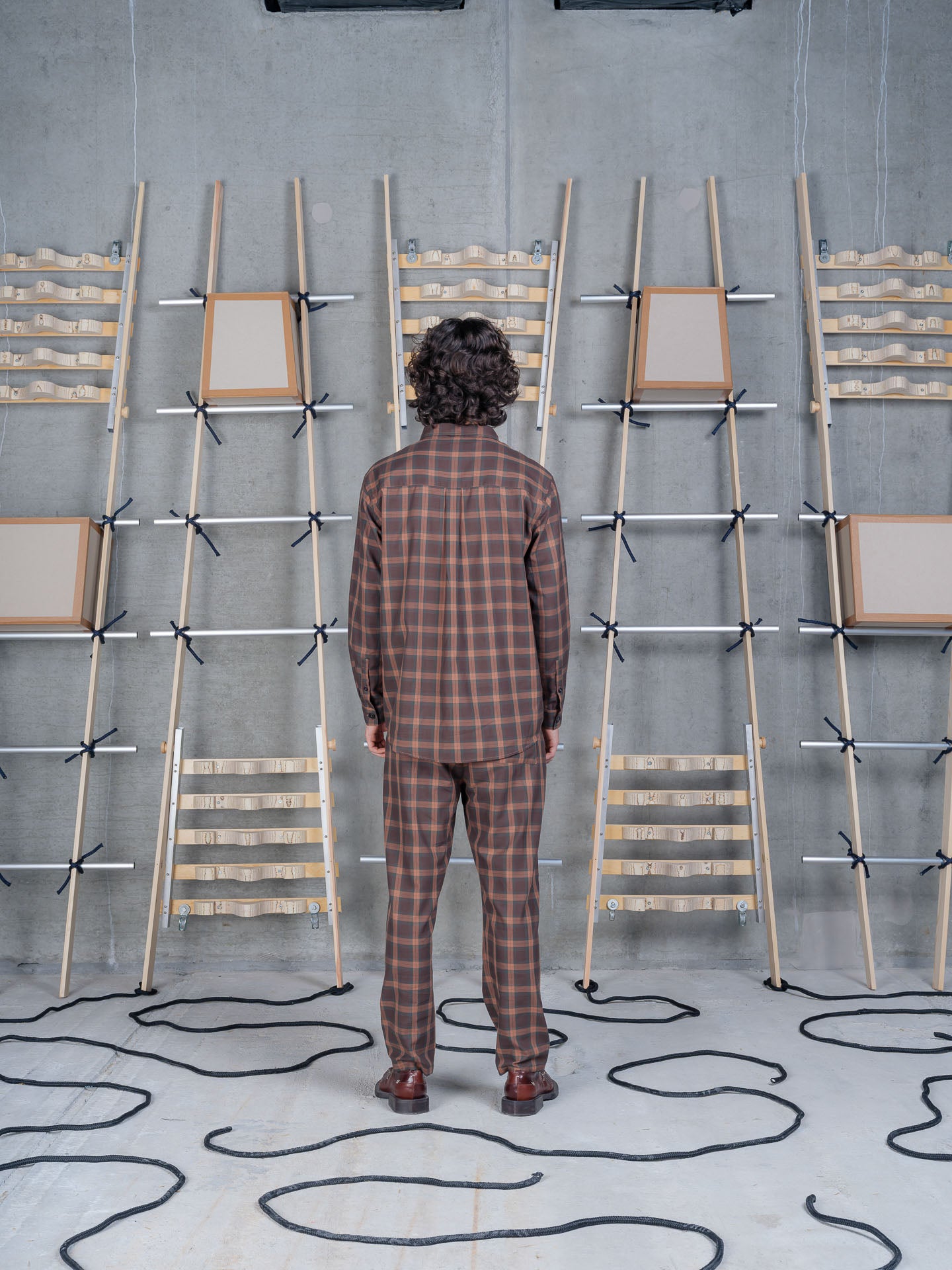 Henrik Vibskov Block Shirt Brown Cotton Checks, model rear view, showing back yoke and pleat detail