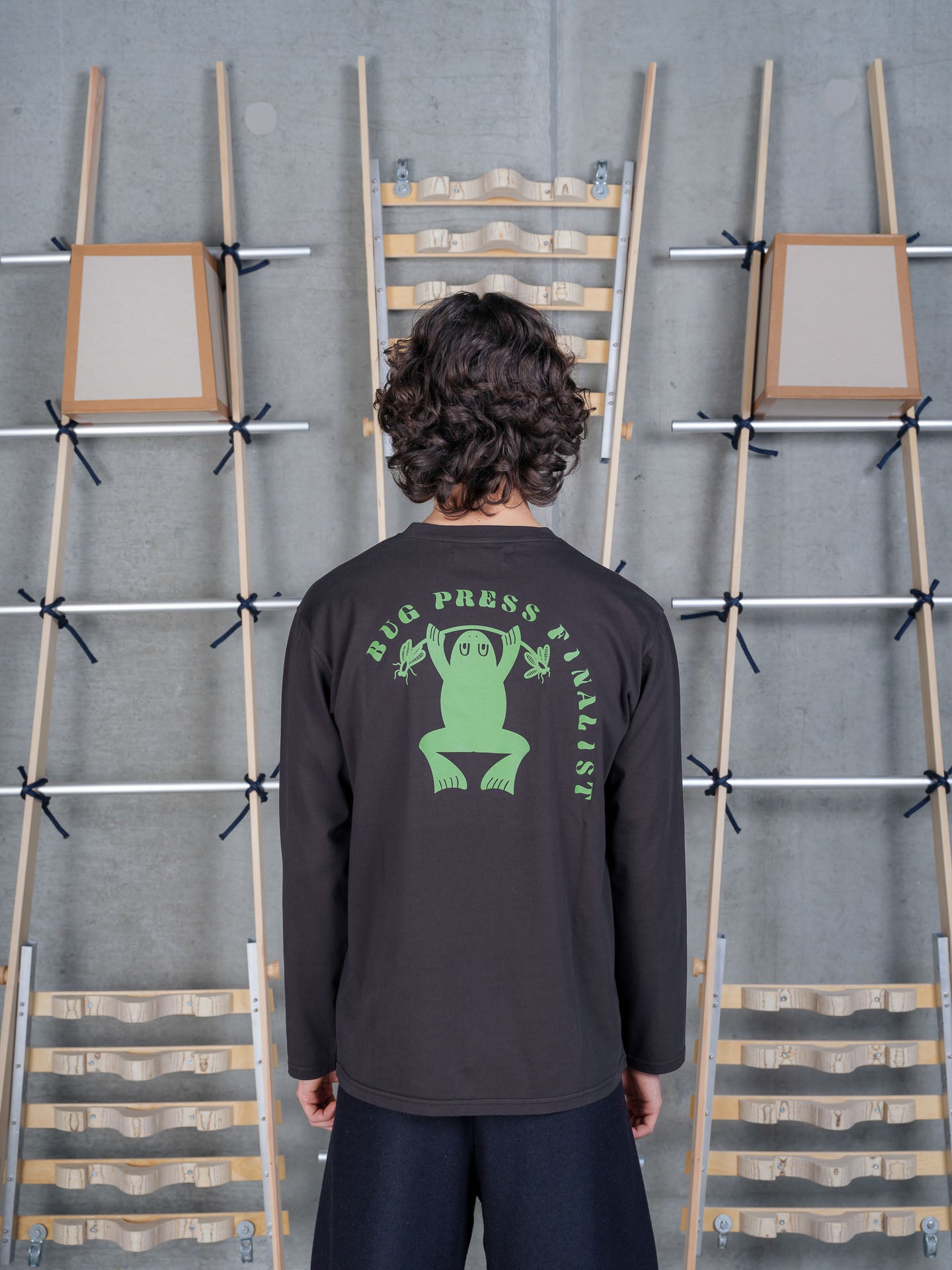 Henrik Vibskov Bug Press Blouse in Black on-model back view, relaxed fit, long-sleeve crew neck, solid black back panel