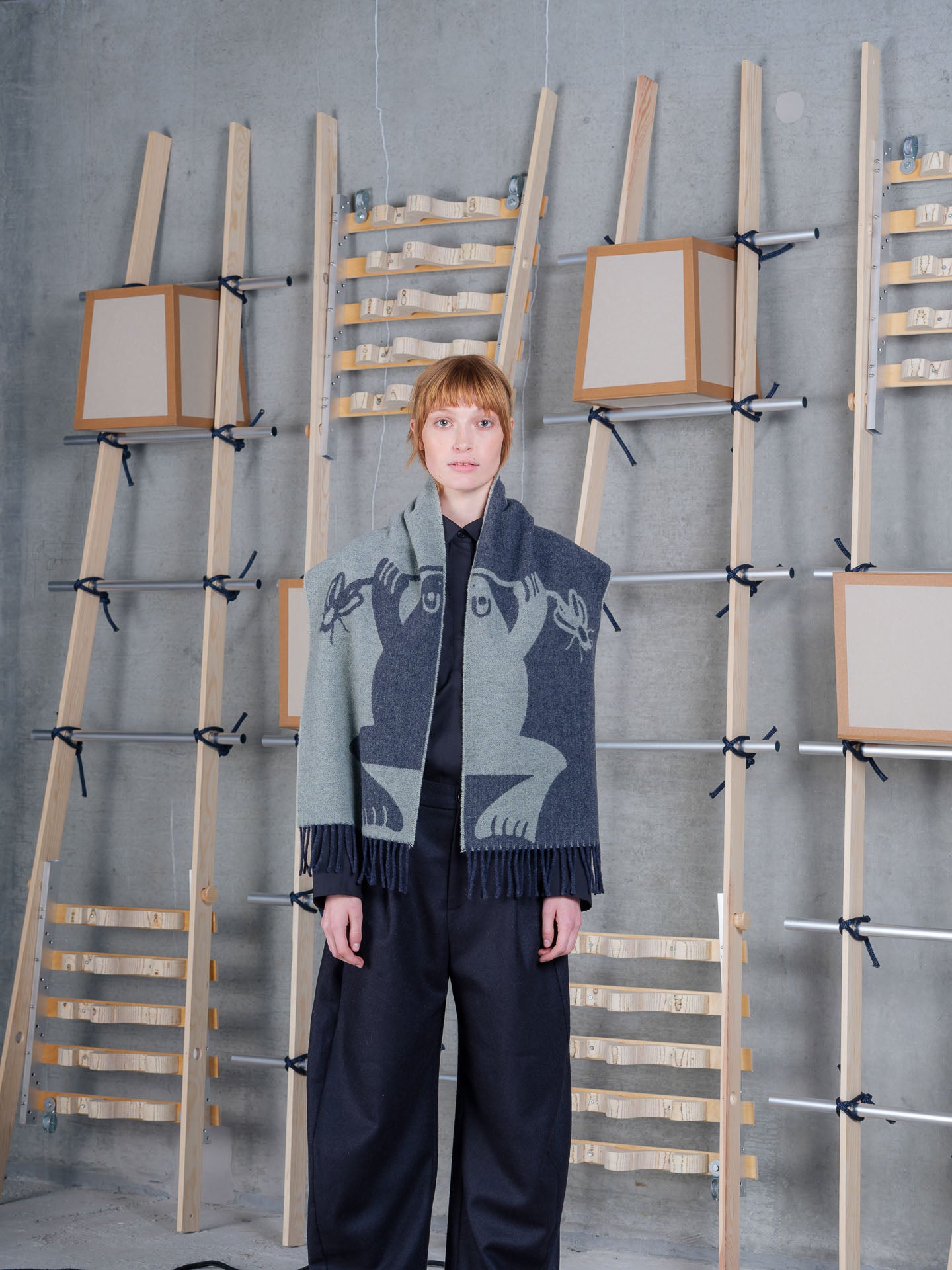 Henrik Vibskov Bug Press Scarf Black Bug Mint Grey, model front view, scarf draped over shoulders with black trousers