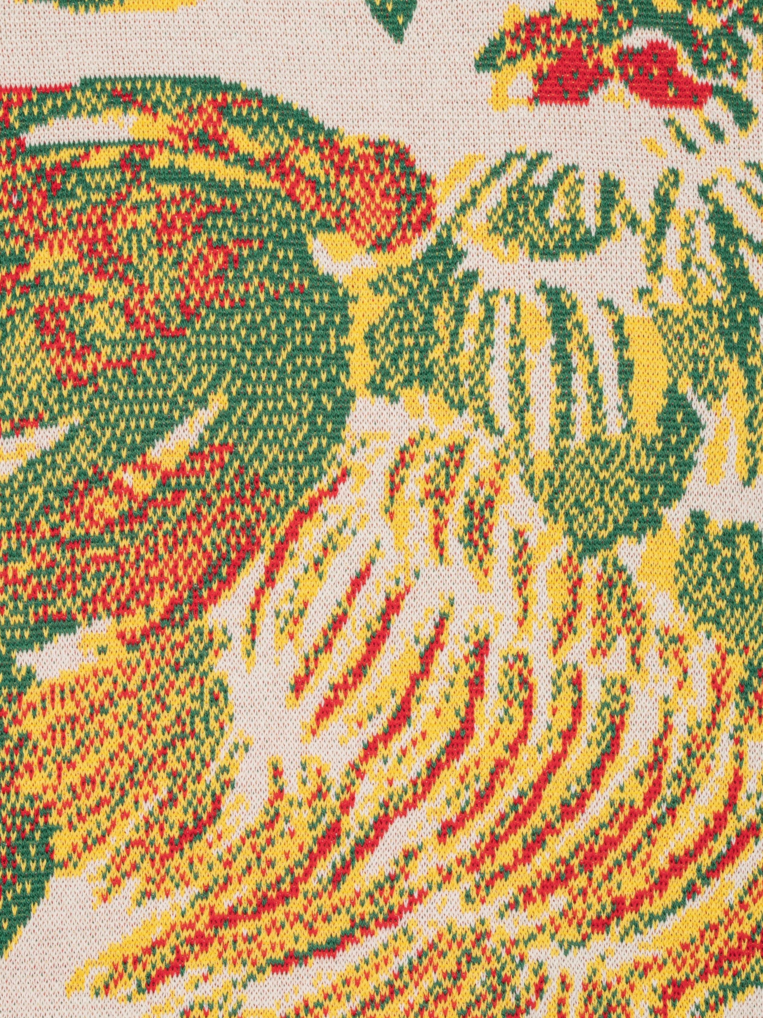 Close-up packshot of the Chicken T Knit in Chicken Ecru from Henrik Vibskov Spring/Summer 2026 Studio Collection, showing the knitted texture and detailed chicken motif.