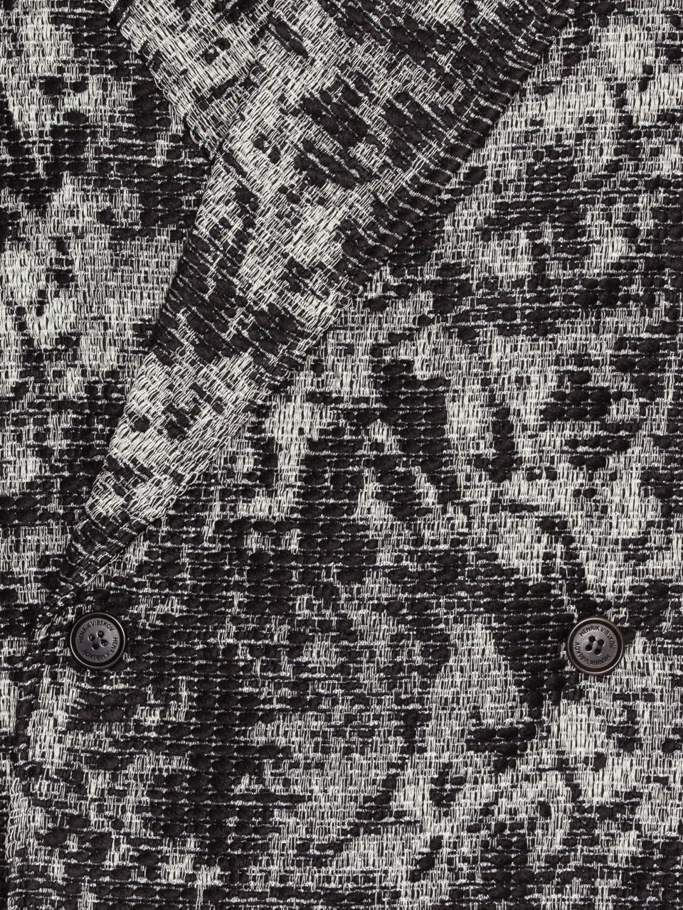 Henrik Vibskov Dimout Coat in Black 3D White, close-up of textured jacquard tweed, dimensional camouflage-like raised pattern detail