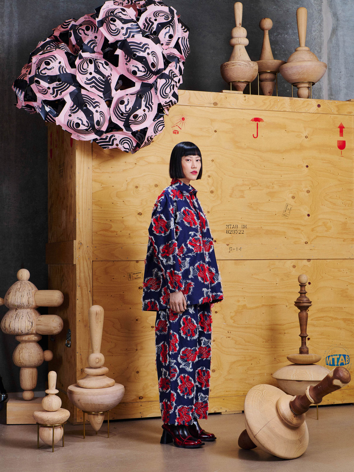 Side view of model wearing the Henrik Vibskov Love You Blouse in Red Navy Birdy, showing the loose fit and textured bird pattern.