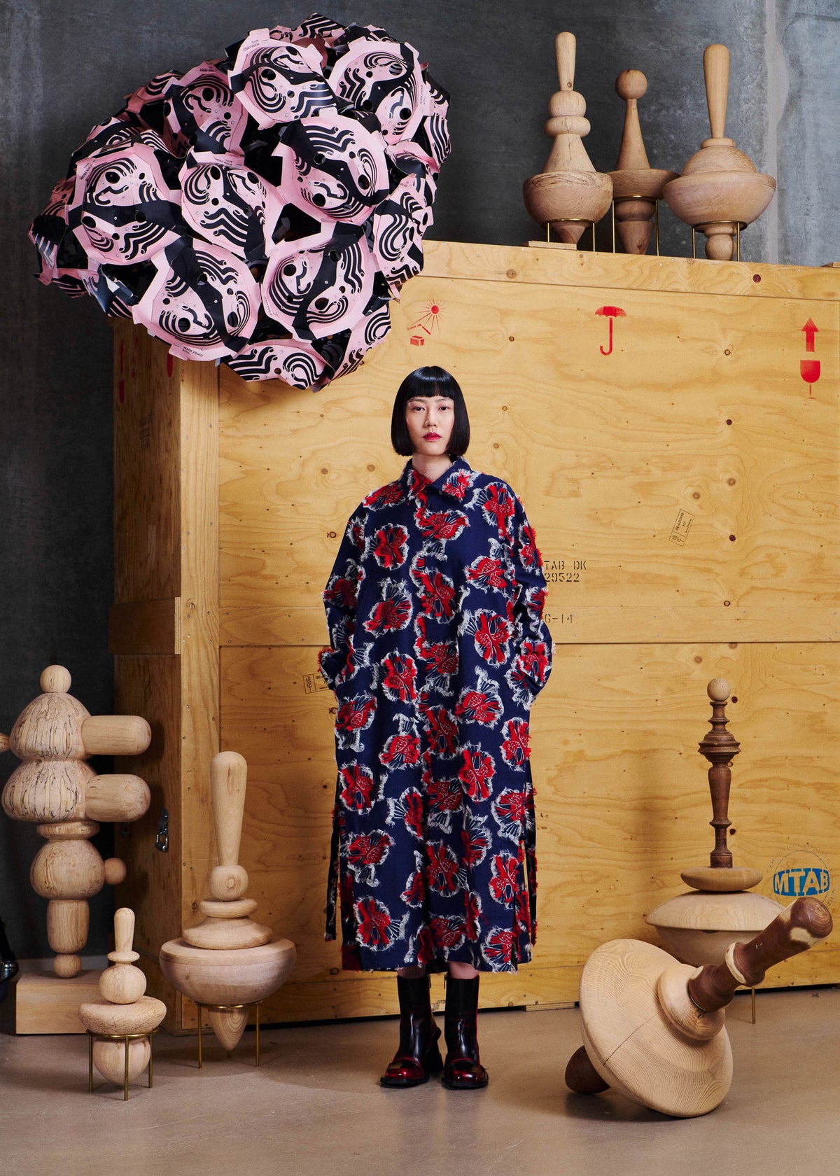 Henrik Vibskov Love You Dress in Red Navy Birdy styled on model from the front with hands in pockets, showing the long silhouette and textured bird jacquard. ID: ARCHIVE-F302