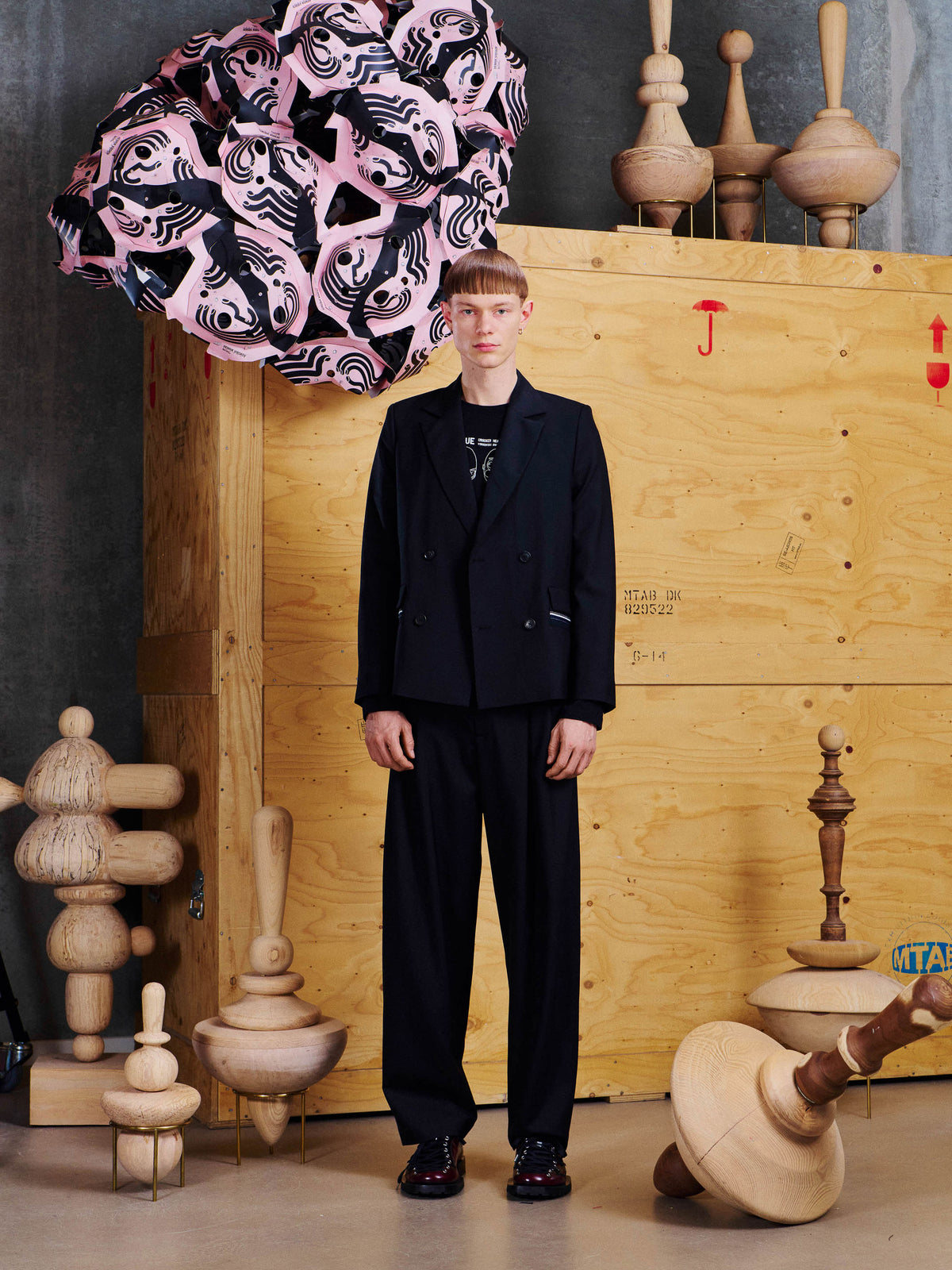 Model wearing the Henrik Vibskov Motif Blazer from the front, showing the tailored silhouette, structured shoulders and double-breasted fastening.