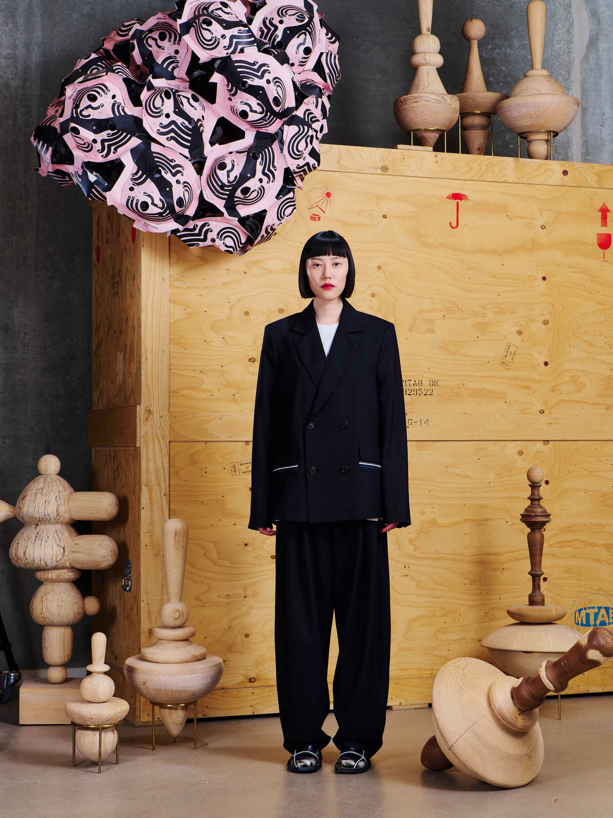 Model wearing the Henrik Vibskov Motif Blazer from the front, showing the tailored silhouette, structured shoulders and double-breasted fastening.
