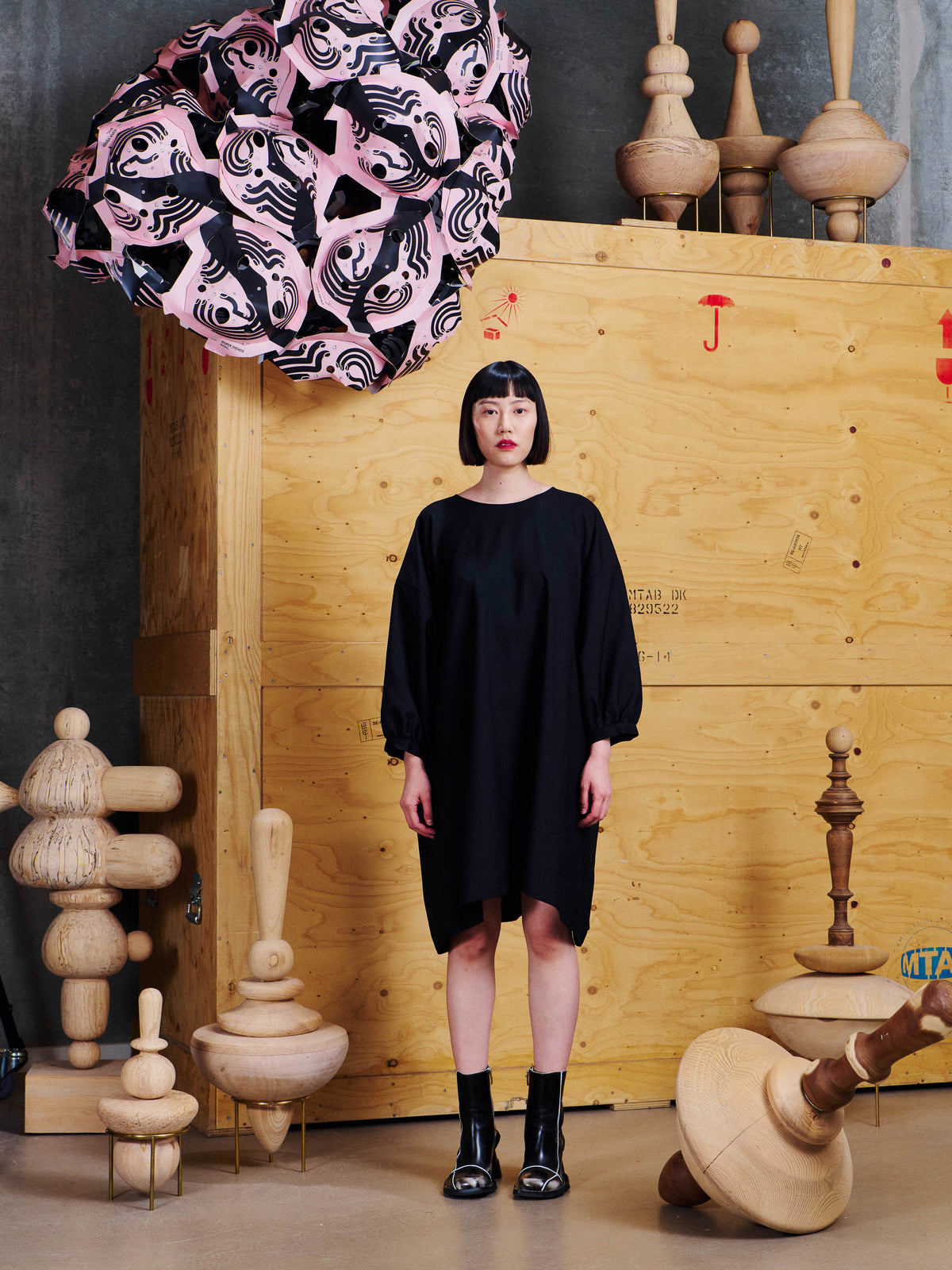 Henrik Vibskov Non Chalant Dress in Black worn front view, showing the relaxed knee-length shape and softly gathered sleeves.