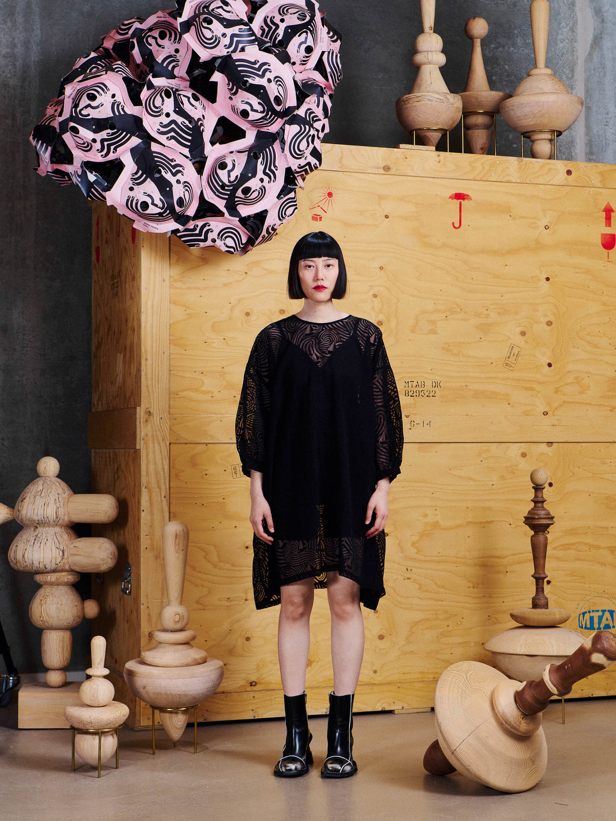 Model wearing the Henrik Vibskov Non Chalant Dress in Dark Stormy Sea from the front, showing the relaxed A-line silhouette and semi-sheer patterned construction.