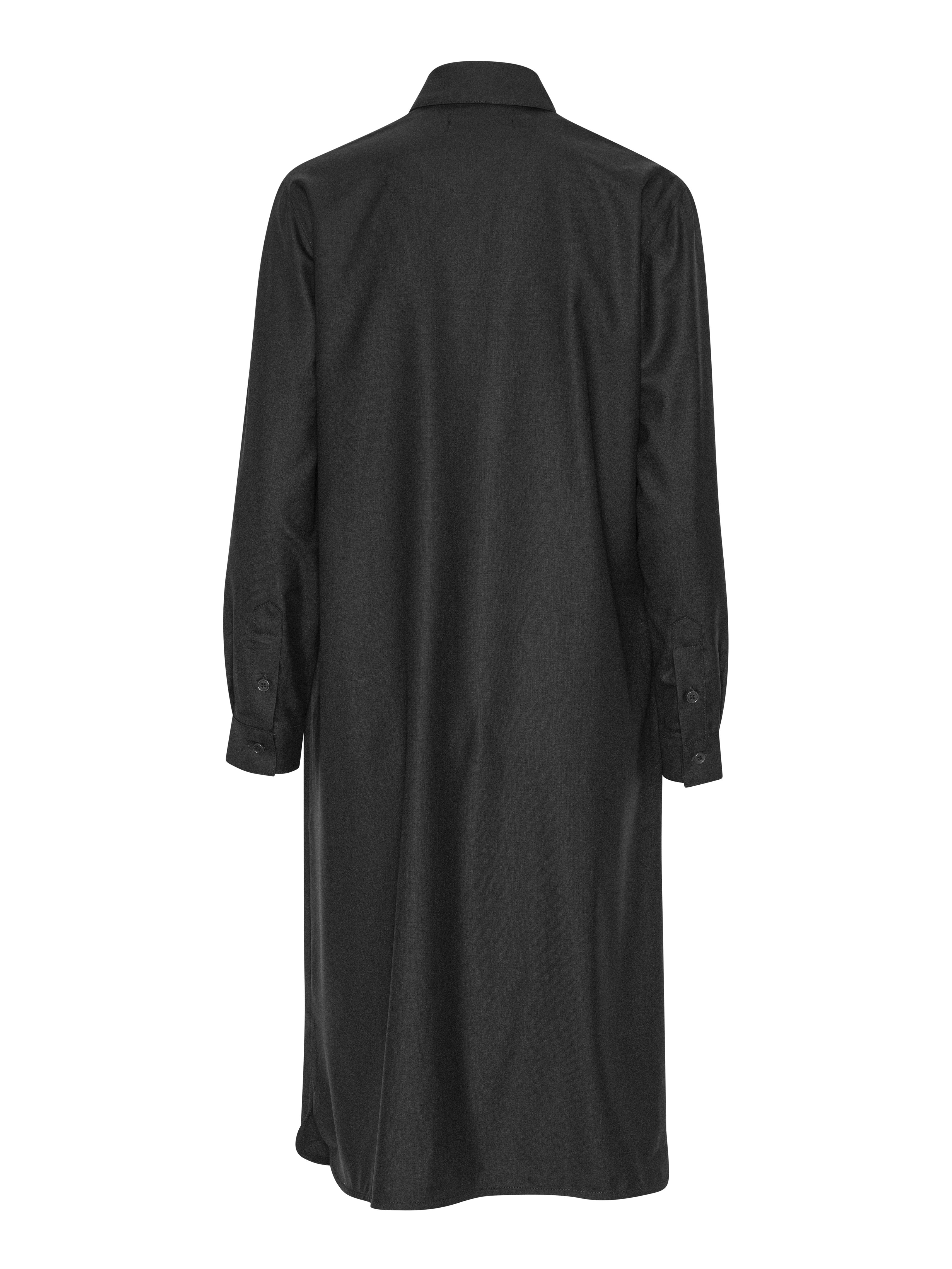 Black shirt dress from Henrik Vibskov on a white background
