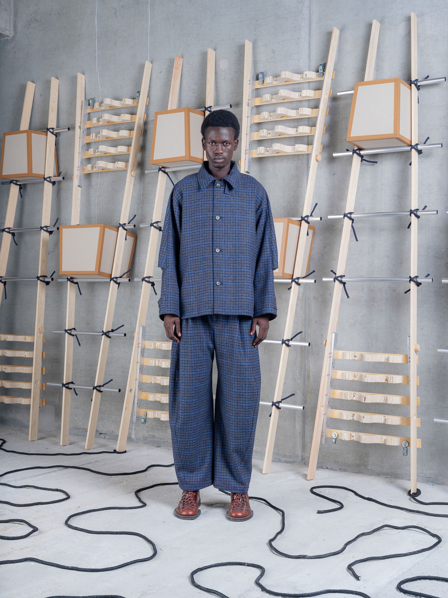 Henrik Vibskov Uncut Jacket Blue Wool Checks, model front view, styled with matching checked trousers