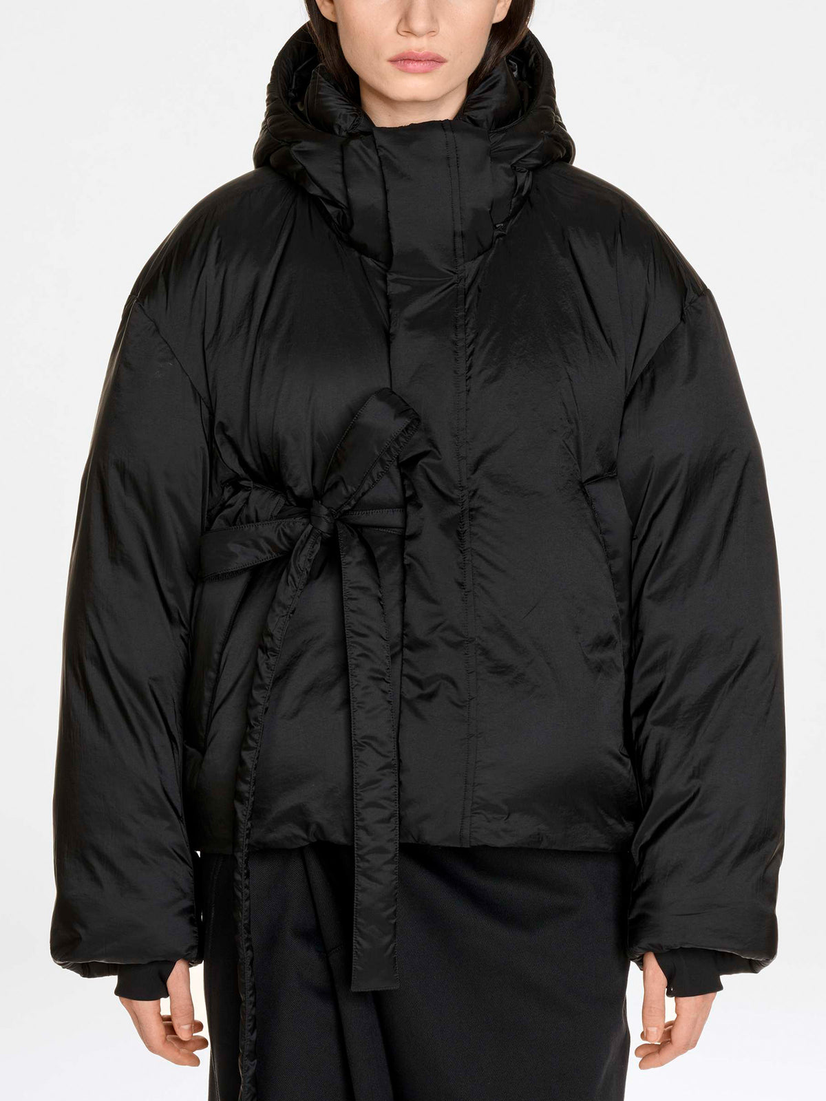 Y-3 Hooded Puffer Jacket in Black - close portrait view on model showing hood and ribbed cuff detail