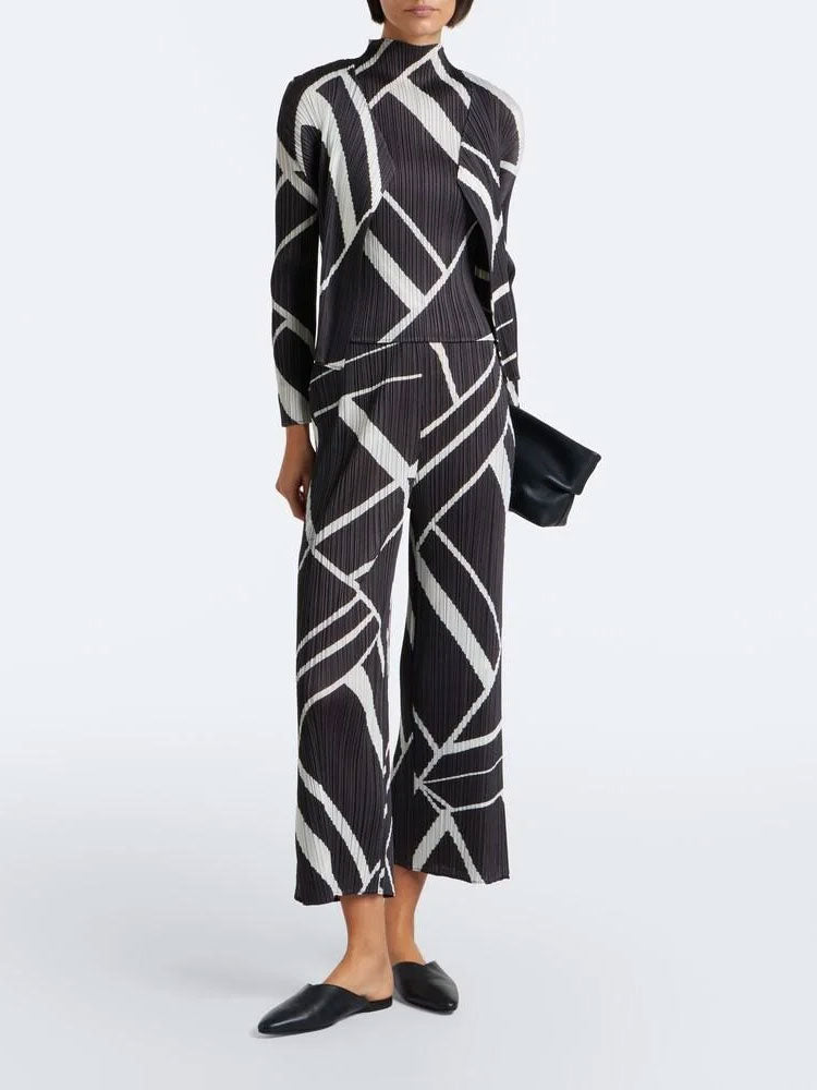 PLEATS PLEASE ISSEY MIYAKE Fold Line Pants in Charcoal worn with matching pleated top, showing full-length front fit