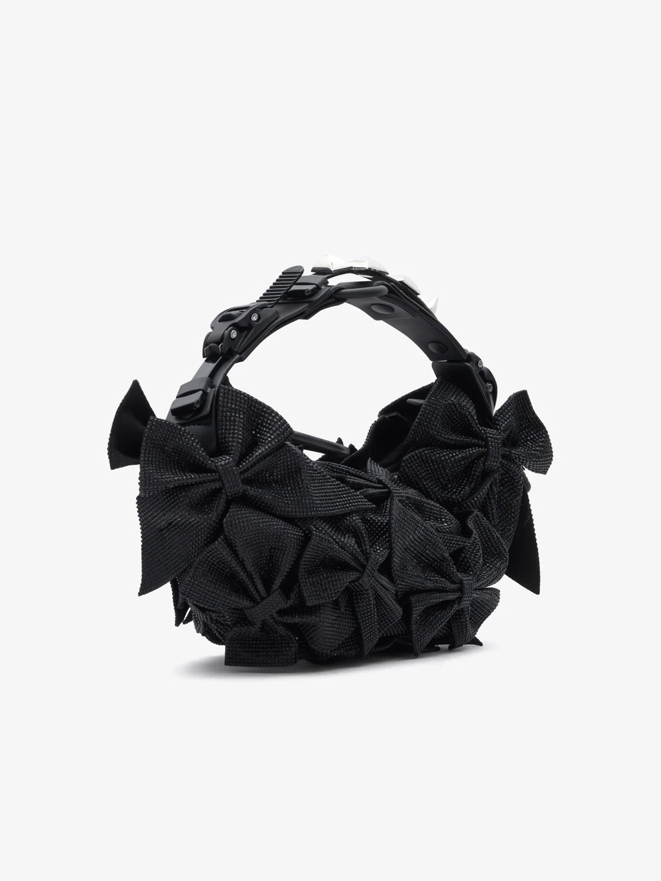 Angled view of the Junya Watanabe Innerraum Bag in Black, showing the dimensional bow-covered body and structured adjustable handle.