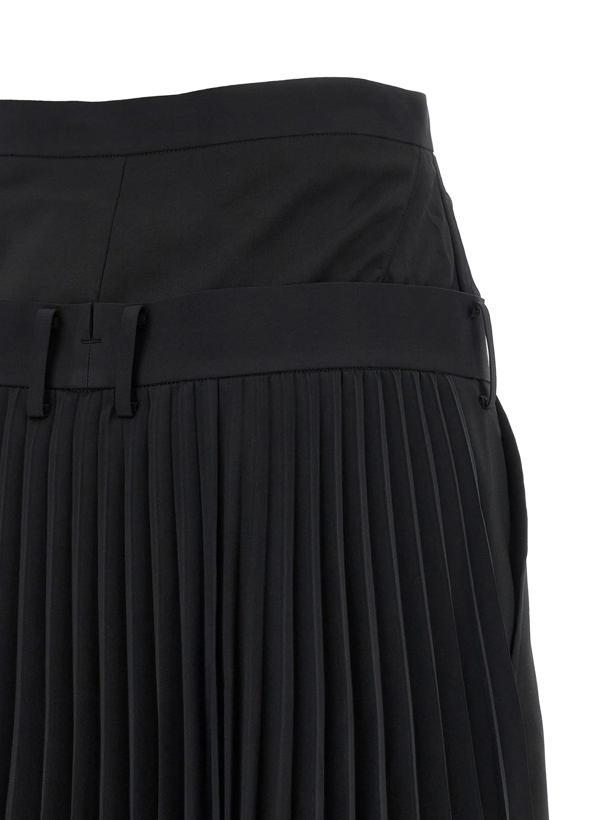 Junya Watanabe Women's Layered Half-Pleated Trousers in black, close-up of back waistband with belt loops and pleated skirt layer below