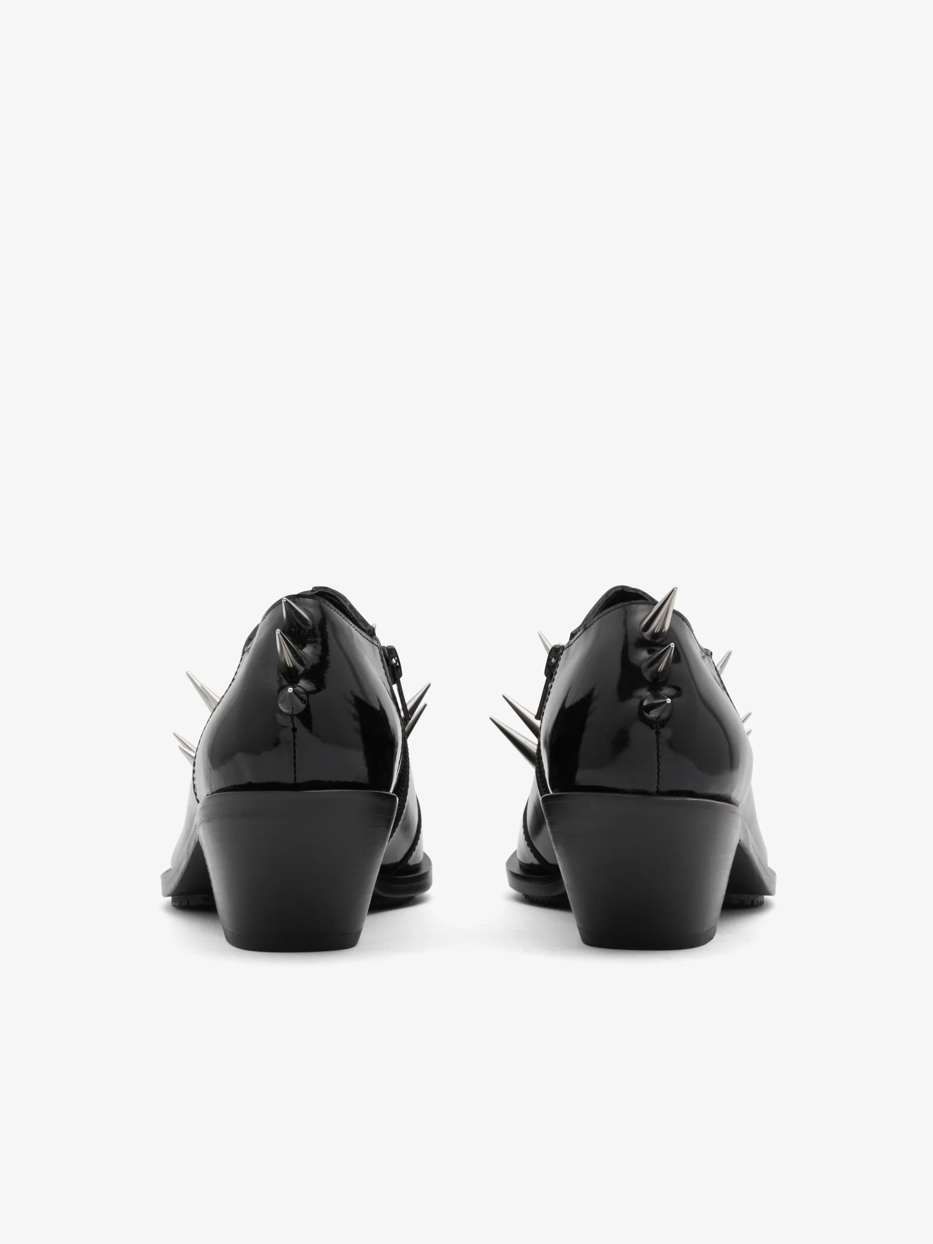 Junya Watanabe Women's Spiked Leather Shoes in Black, back view showing the heeled outsole and spike detailing at the heel.