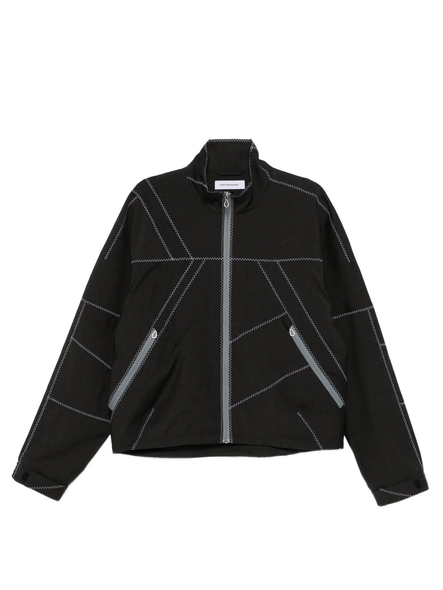 Dark brown jacket with white geometric contrast stitching from Kiko Kostadinov on a white background
