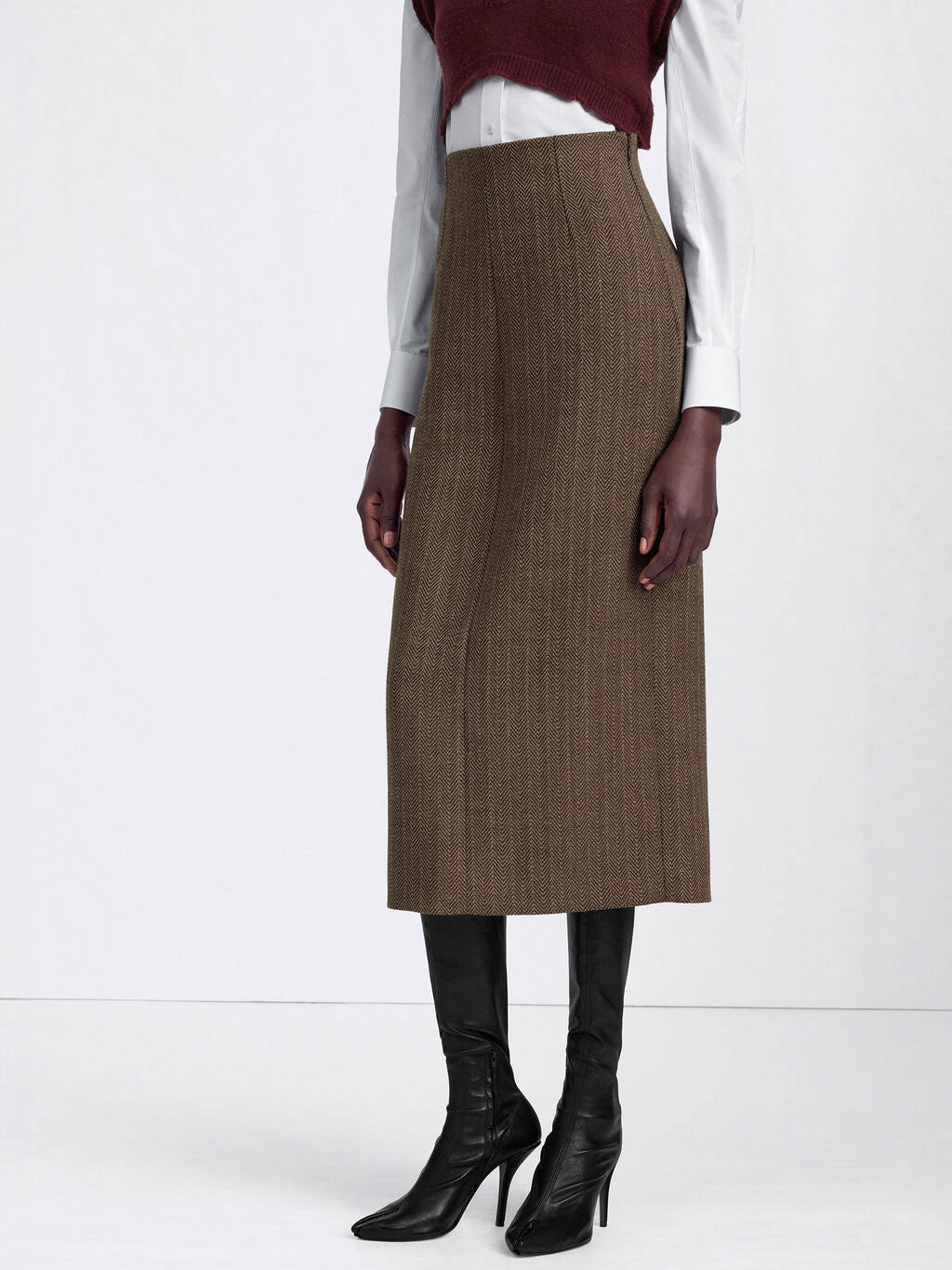 Model wearing the Maison Margiela Midi Skirt in Beige, showing the high waist and fitted straight silhouette.