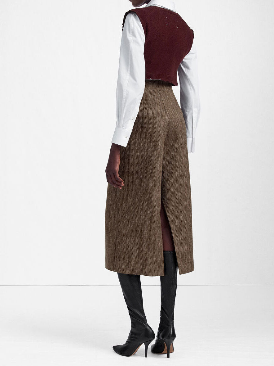 Rear view of the Maison Margiela Midi Skirt in Beige, showing the back slit and signature four stitches.