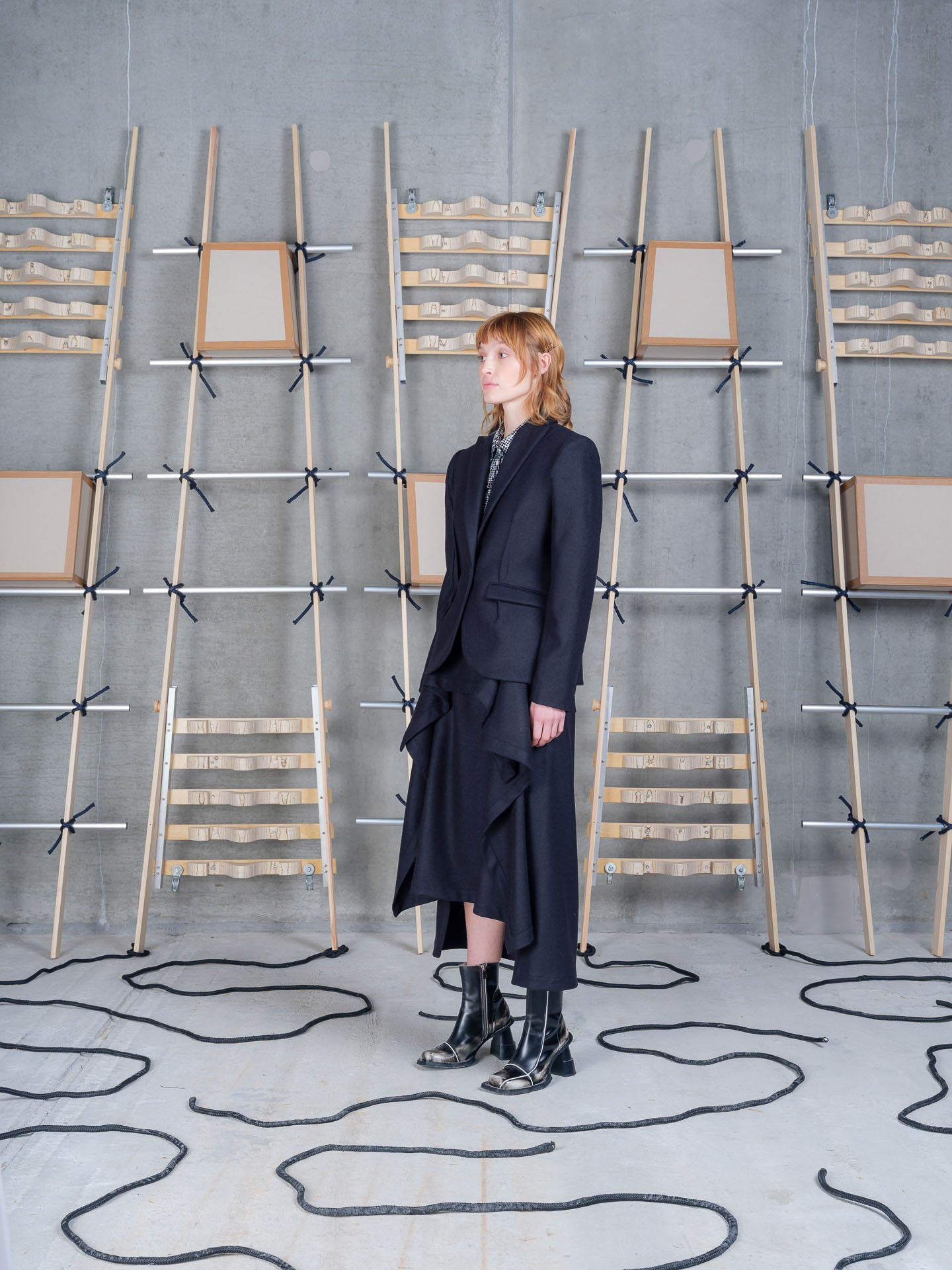 Model wearing Henrik Vibskov Press Blazer in Black side view
