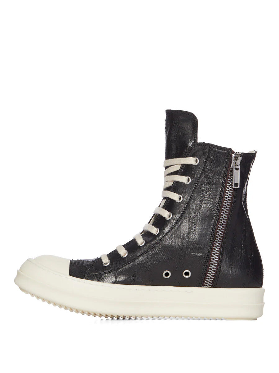 Side view of Rick Owens DRKSHDW Tower Sneaks in Black Megacrust Denim showing inside ankle zip fastening, cracked foil finish and milk white shark tooth sole